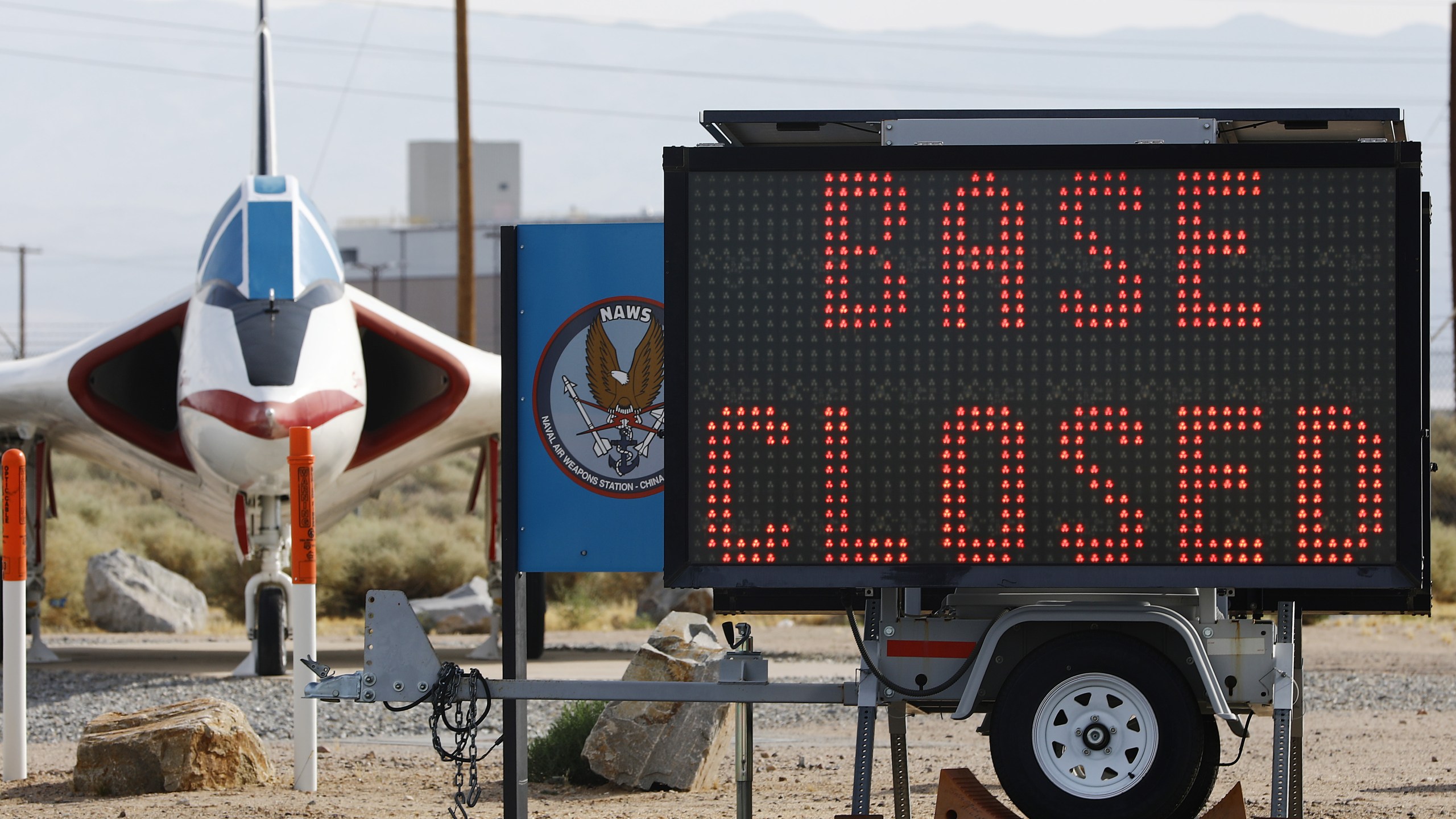 A sign says "Base Closed" outside the main gate to Naval Air Weapons Station (NAWS) China Lake on July 7, 2019, in Ridgecrest, Calif. (Credit: Mario Tama/Getty Images)