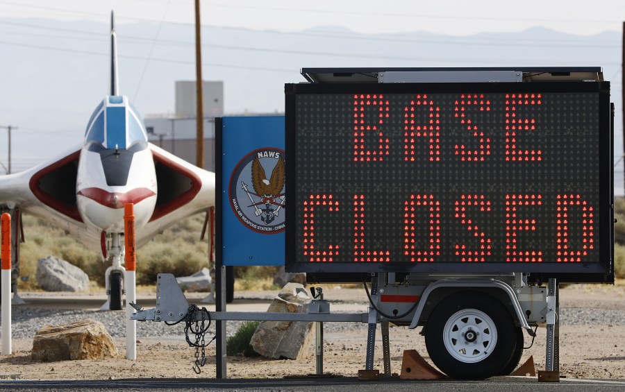 A sign says "Base Closed" outside the main gate to Naval Air Weapons Station (NAWS) China Lake on July 7, 2019, in Ridgecrest, Calif. (Credit: Mario Tama/Getty Images)