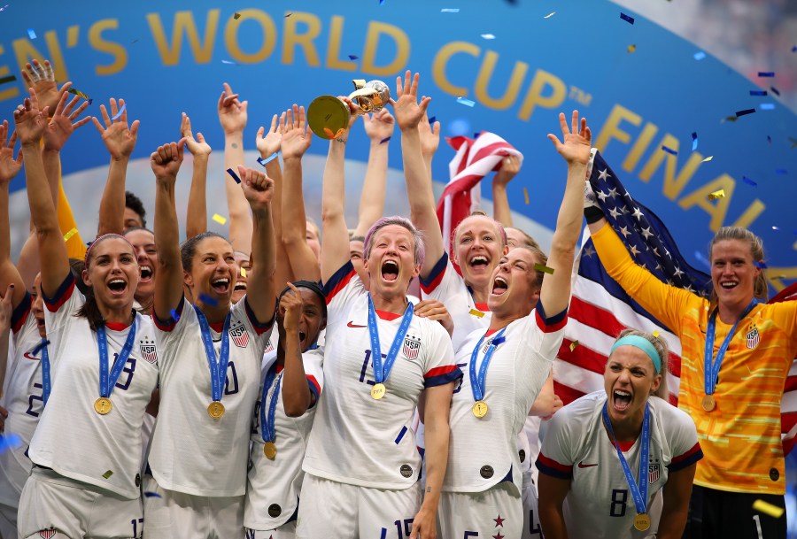 Megan Rapinoe lifts the trophy as the U.S. Women’s National Soccer Team celebrates their victory during the 2019 FIFA Women's World Cup final match between the U.S. and the Netherlands on July 7, 2019, in Lyon, France. (Richard Heathcote/Getty Images)