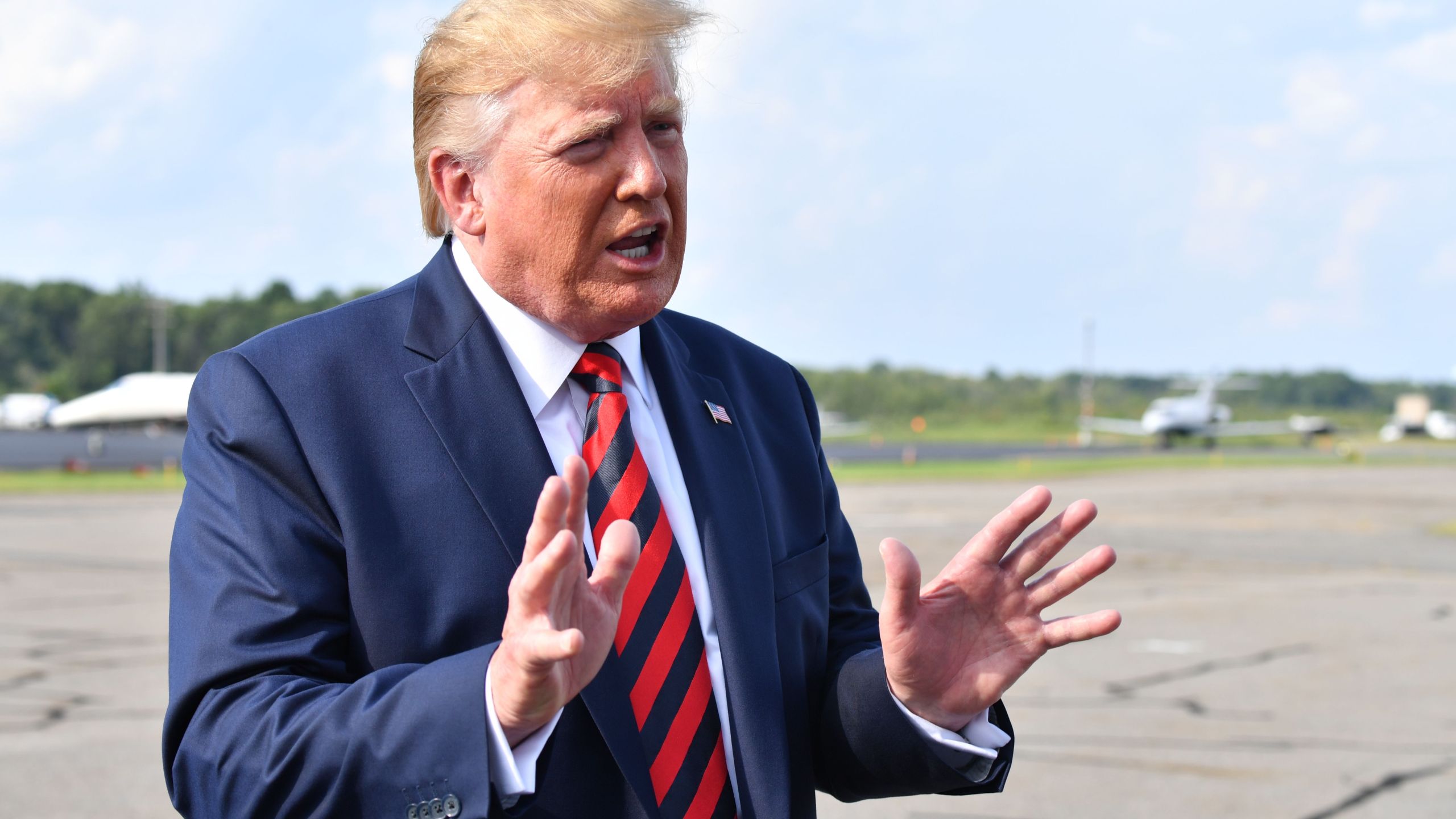 US President Donald Trump speaks to the press before boarding Air Force One in Morristown, New Jersey, on August 18, 2019. (Credit: NICHOLAS KAMM/AFP/Getty Images)