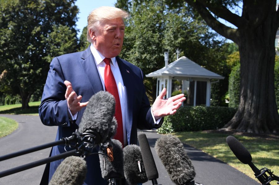 US President Donald Trump speaks to the media as he departs the White House in Washington, DC, on August 21, 2019. (Credit: JIM WATSON/AFP/Getty Images)