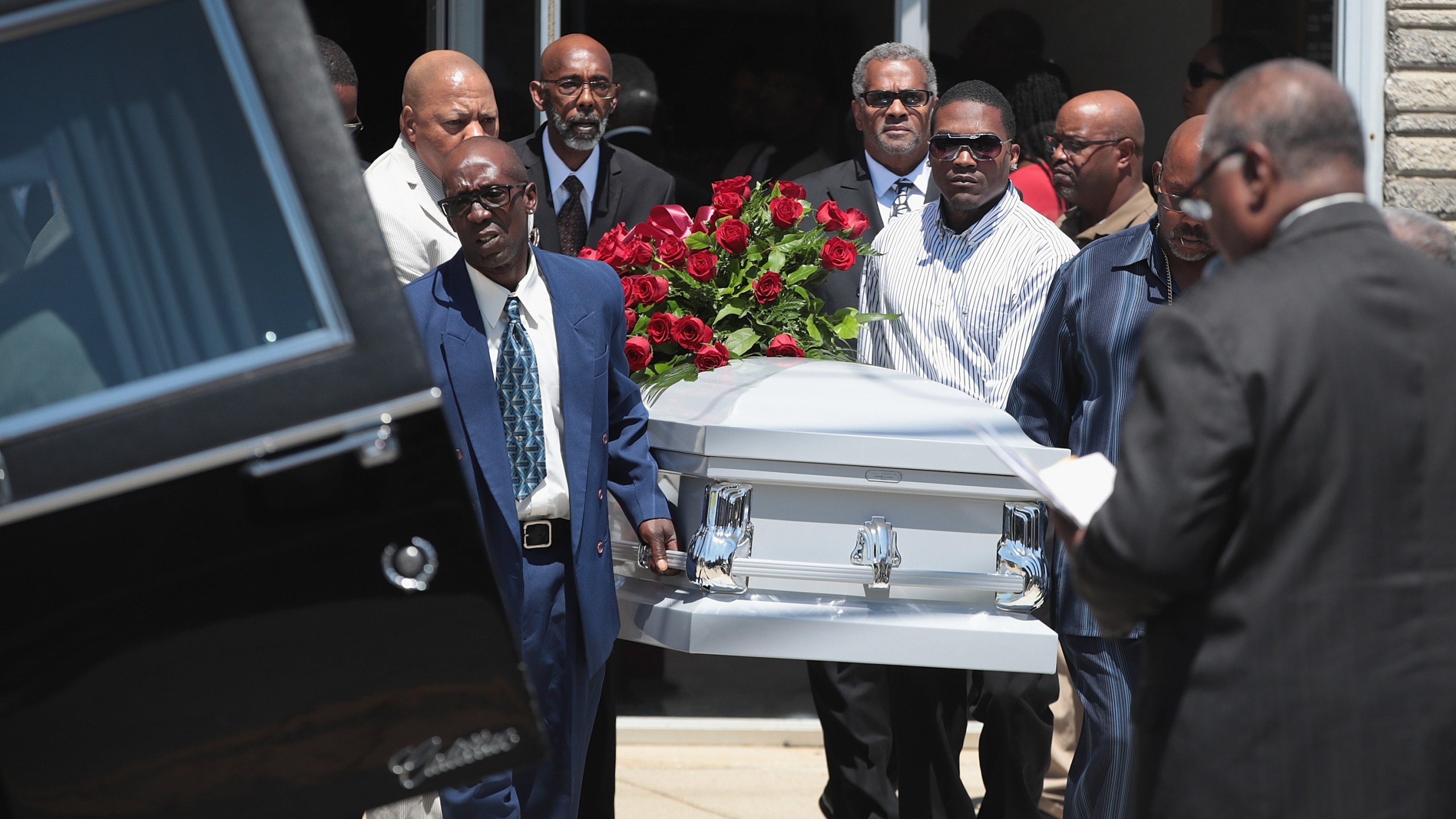 The remains of Derrick Fudge, 57, are placed in a hearse outside of St. John Missionary Baptist Church in Springfield, Ohio, following his funeral service on Aug. 10, 2019. Fudge was one of nine people killed when 24-year-old Connor Betts opened fire with a AR-15 style rifle in nearby Dayton.(Credit: Scott Olson / Getty Images)