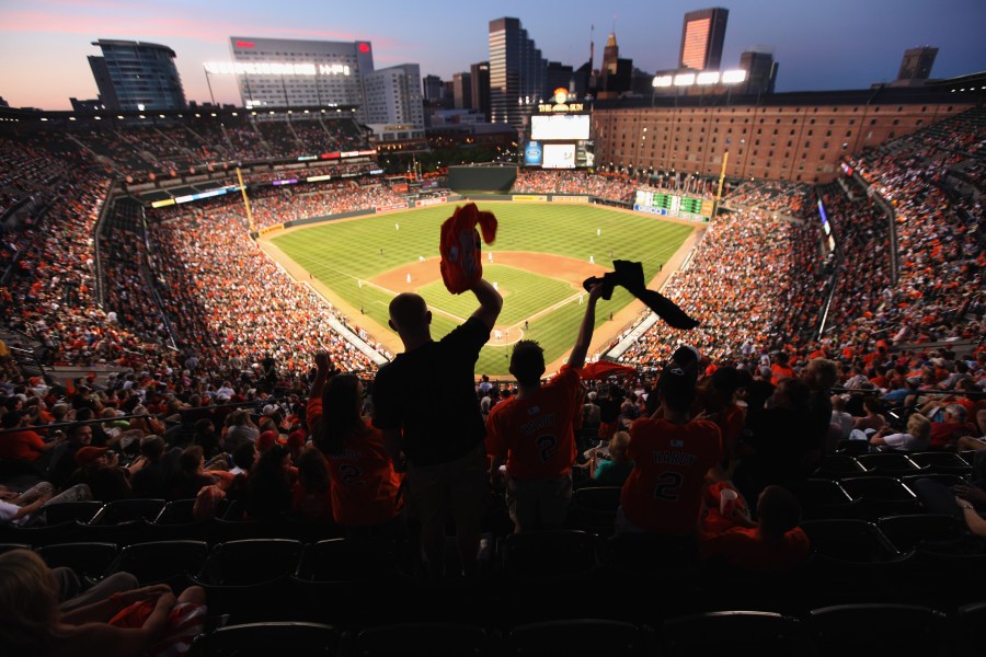 Fans cheer during a match between Baltimore Orioles and St. Louis Cardinals at Oriole Park at Camden Yards on June 30, 2011 in Baltimore, Maryland. (Credit: Rob Carr/Getty Images)