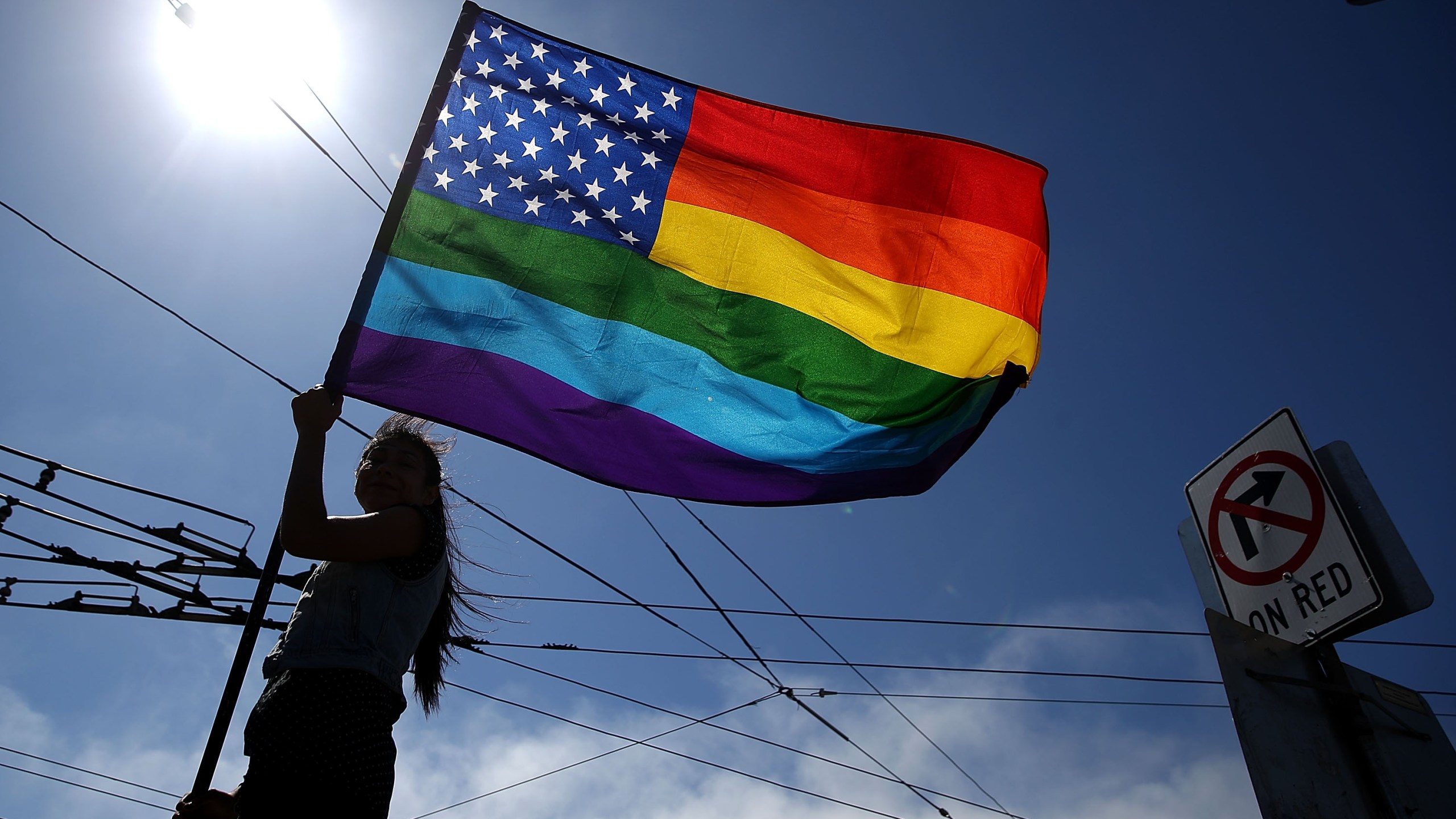 A person waves a pride flag on June 26, 2015 in San Francisco. (Credit: Justin Sullivan/Getty Images)