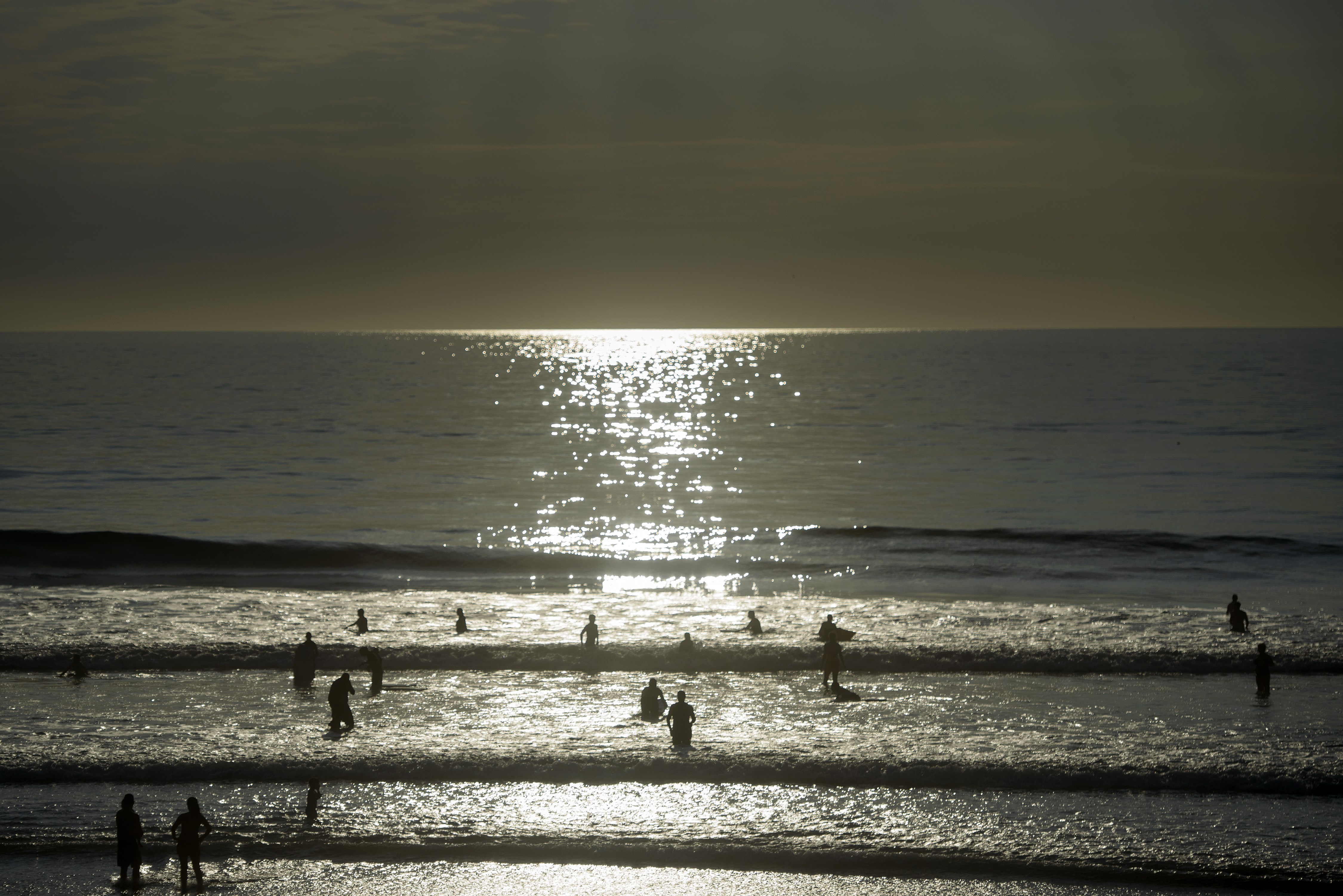 People swim in the Pacific Ocean off Del Mar beach Oct. 11, 2015, in La Jolla, Calif. (Credit: BRENDAN SMIALOWSKI/AFP/Getty Images)