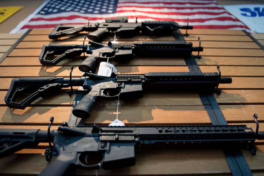 Assault rifles hang on the wall for sale at Blue Ridge Arsenal in Chantilly, Virginia, on Oct. 6, 2017. (Credit: Jim Watson / AFP / Getty Images)