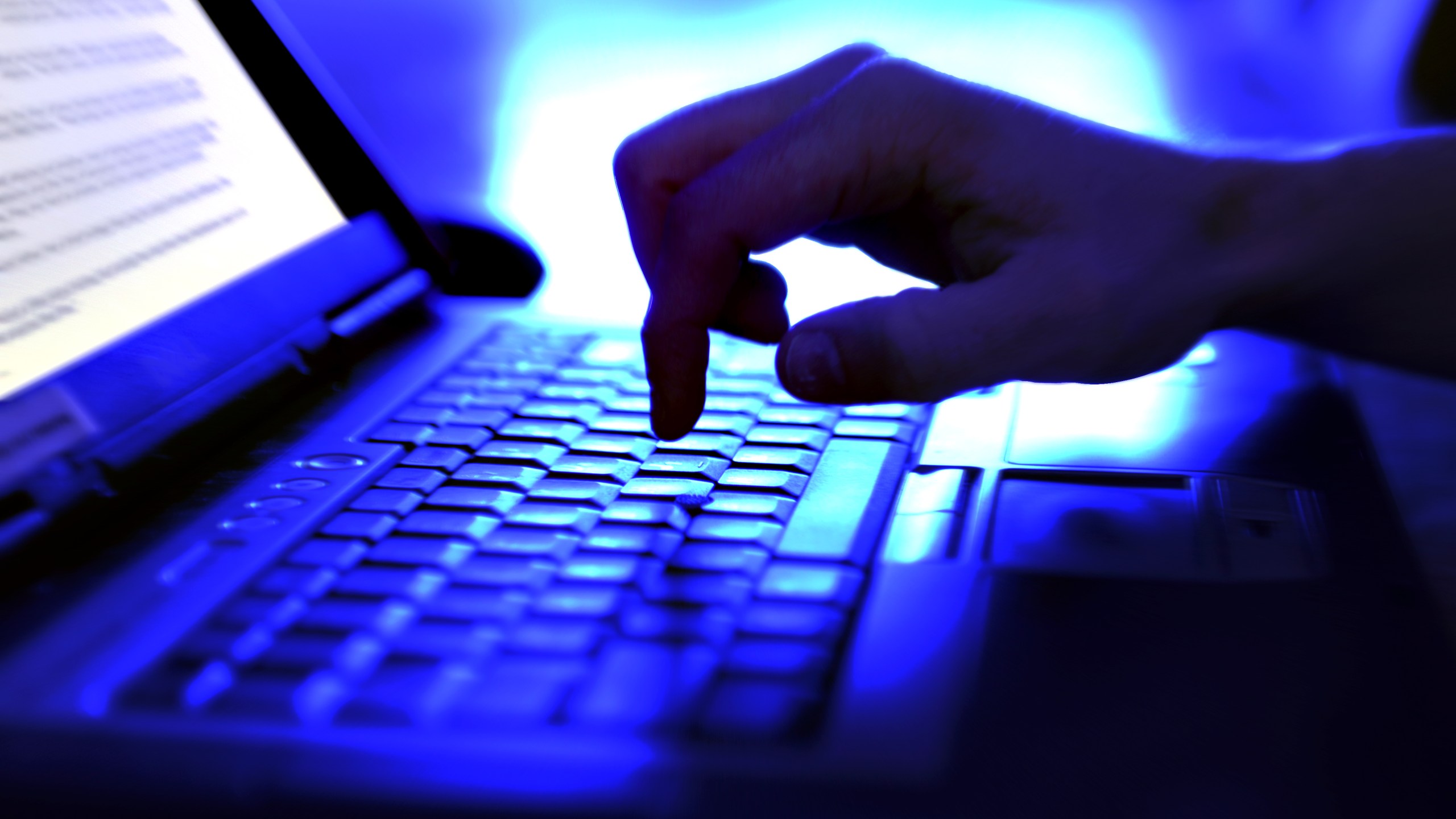 A person is seen typing on a computer. (Getty Images)