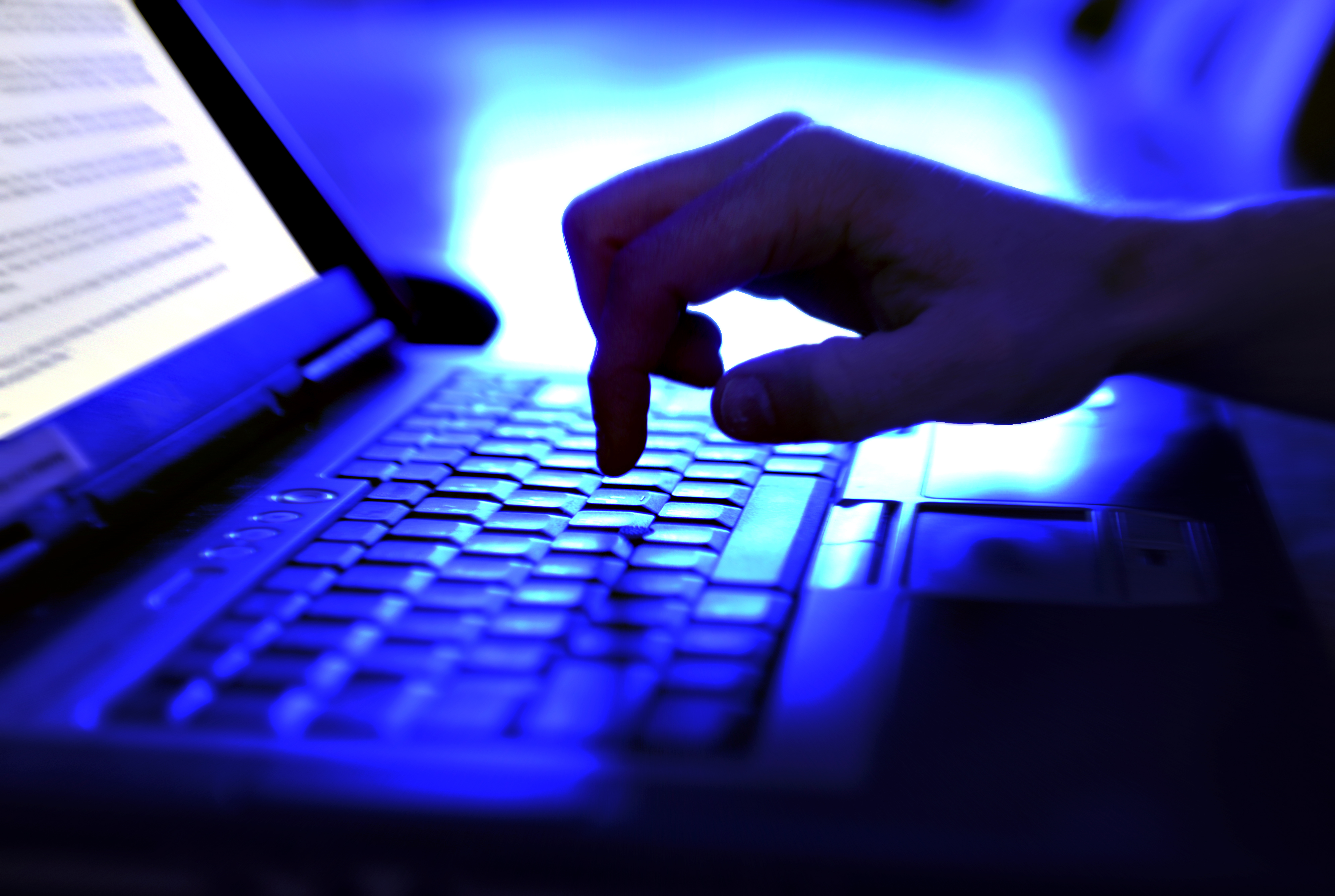 A person is seen typing on a computer. (Getty Images)