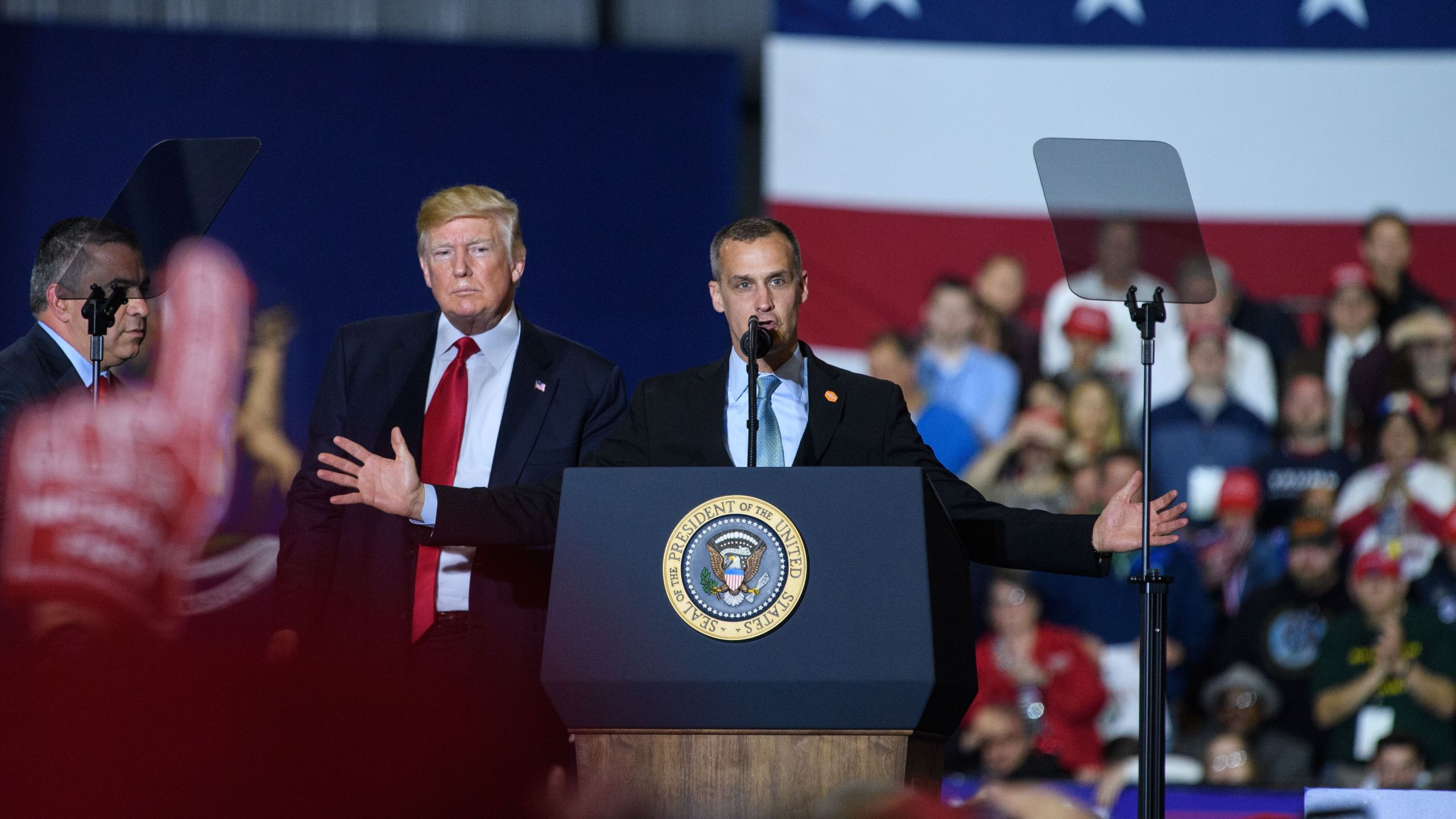 Former Trump Campaign manager Corey Lewandowski speaks as Donald Trump looks on during a rally at Total Sports Park in Washington, Michigan on April 28, 2018. (Credit: MANDEL NGAN/AFP/Getty Images)