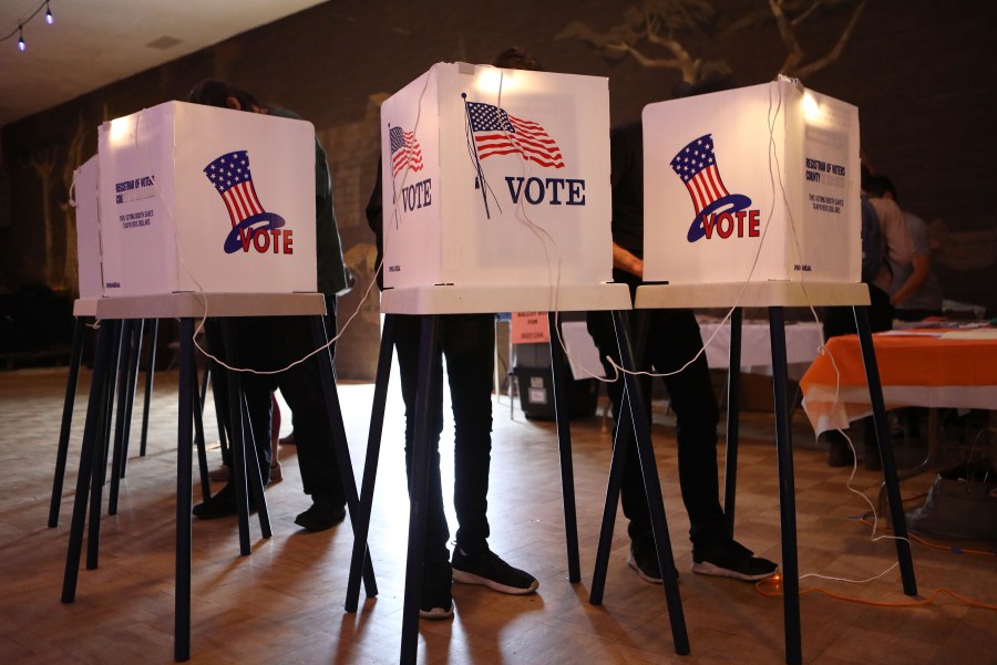 Voters cast their ballots at a Masonic Lodge in Los Angeles on June 5, 2018. (Credit: Mario Tama / Getty Images)