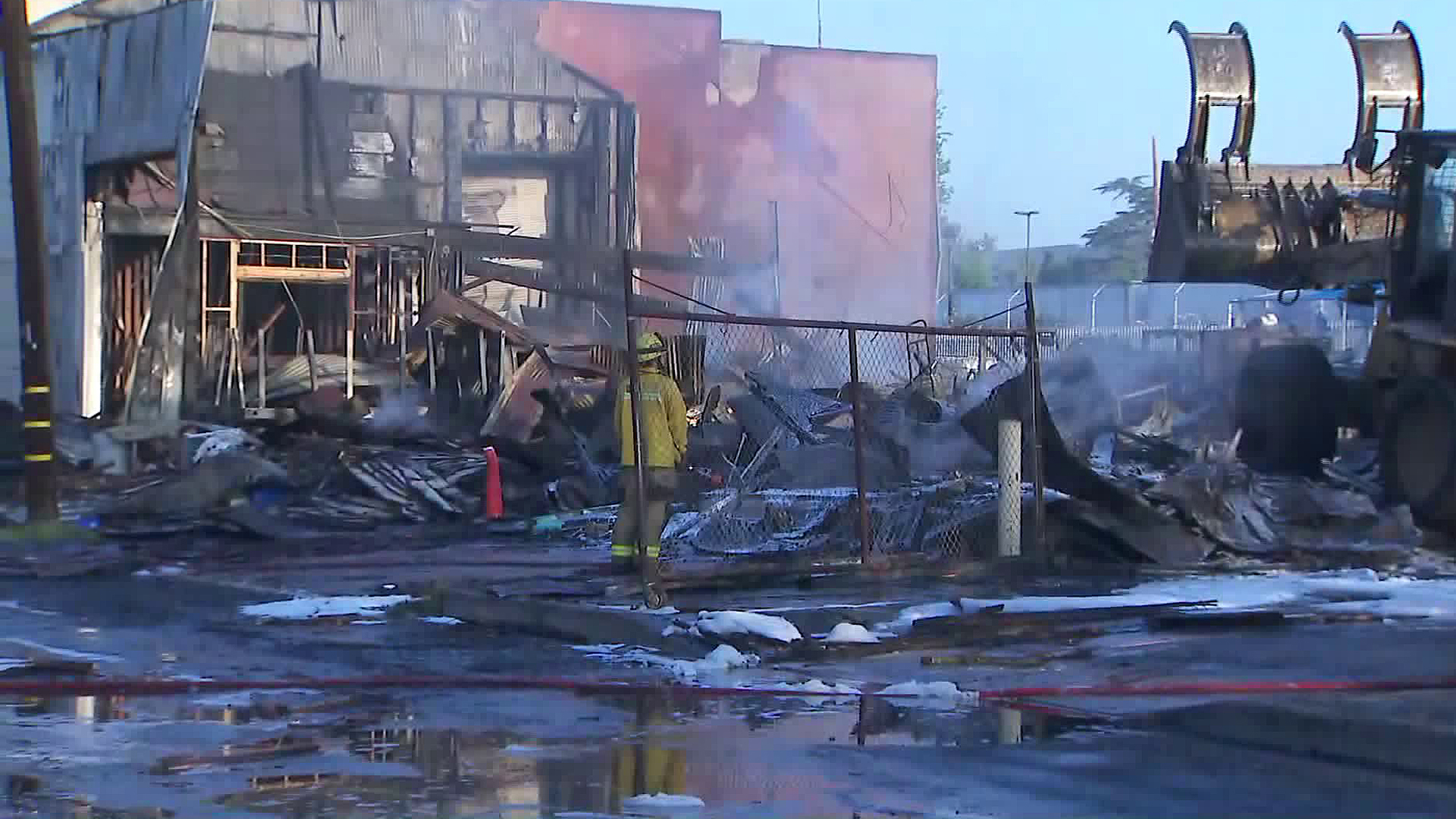 Crews look for hot spots following commercial building blaze in Ontario on Aug. 16, 2019. (Credit: KTLA)