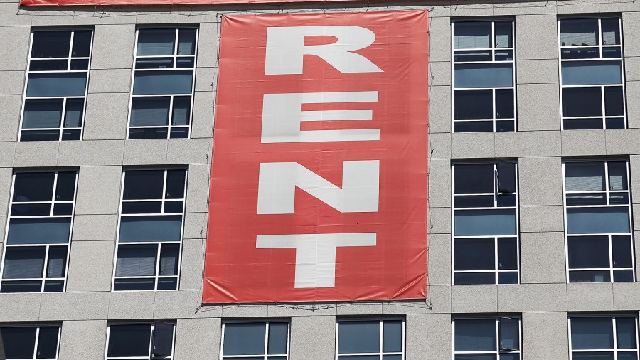 A large "rent" banner is posted on the side of an apartment building on June 15, 2012 in San Francisco, California. (Credit: Justin Sullivan/Getty Images)