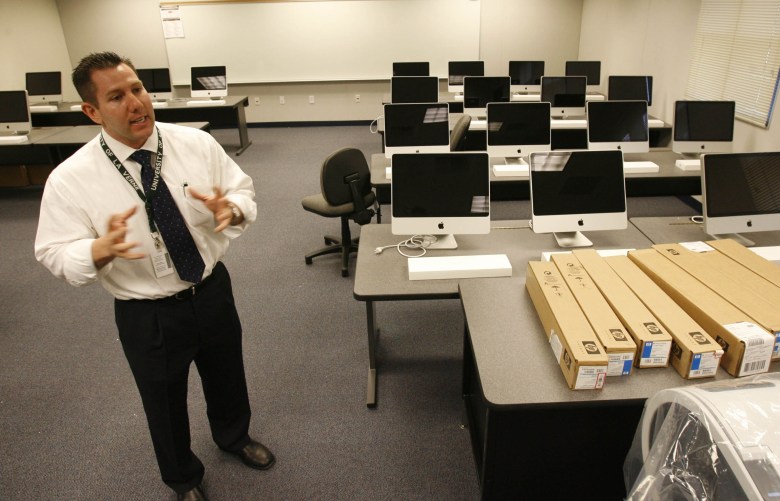 Then-Principal Perry Wiseman talks about the Colonel Rodriguez PREP Academy computer lab in a 2008 file photo. (Credit: Southern California News Group)