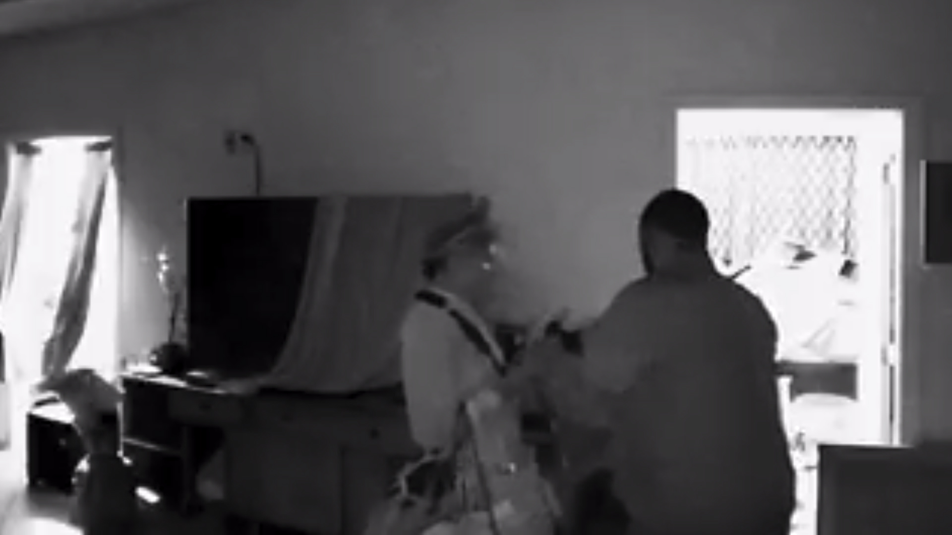 Surveillance footage shows a man and woman breaking into a Jefferson Park home that was undergoing tenting for fumigation on Aug. 15, 2019. (Credit: Melvin Barrientos)