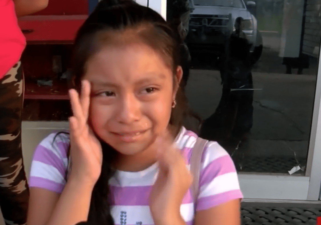 Magdalena Gomez Gregorio cries for her father following immigration raids at Mississippi plants in August 2019. (Credit: WJTV via CNN)