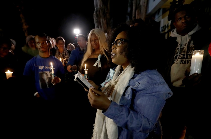 Activist Jasmyne Cannick joins members of West Hollywood's black and gay communities at a candlelight vigil outside the home of Ed Buck in January 2019. (Credit: Luis Sinco / Los Angeles Times)