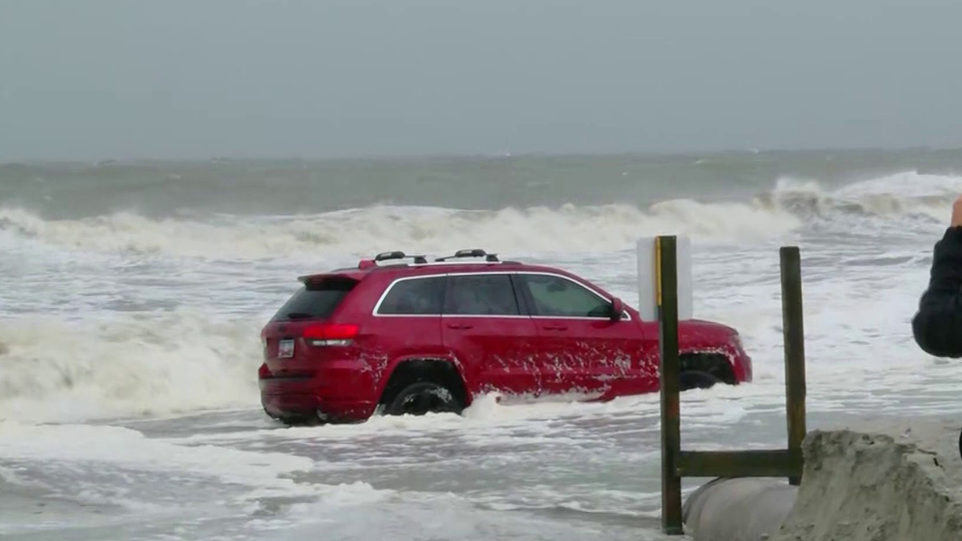 Someone tried driving on the beach in Myrtle Beach, South Carolina, during Hurricane Dorian. They were forced to abandon the vehicle. (Credit: WMBF)