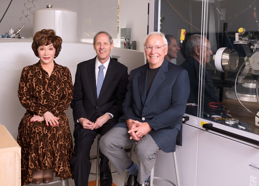 Lynda Resnick, Caltech President Thomas F. Rosenbaum, middle, and Stewart Resnick are seen at a science lab at Caltech in this undated photo.(Credit: Caltech via Los Angeles Times)