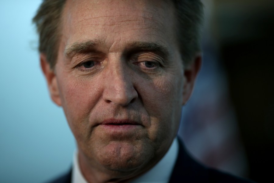 Jeff Flake speaks to reporters following a Senate Judiciary Committee hearing on Capitol Hill Nov. 15, 2018 in Washington, D.C. (Credit: Win McNamee/Getty Images)