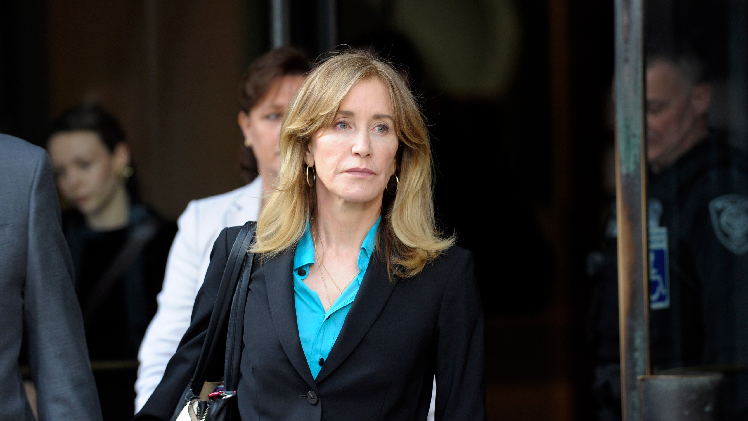 Actress Felicity Huffman exits the courthouse in Boston after facing charges for allegedly conspiring to commit mail fraud and other charges in the college admissions scandal on April 3, 2019. (Credit: Joseph Prezioso / AFP / Getty Images)