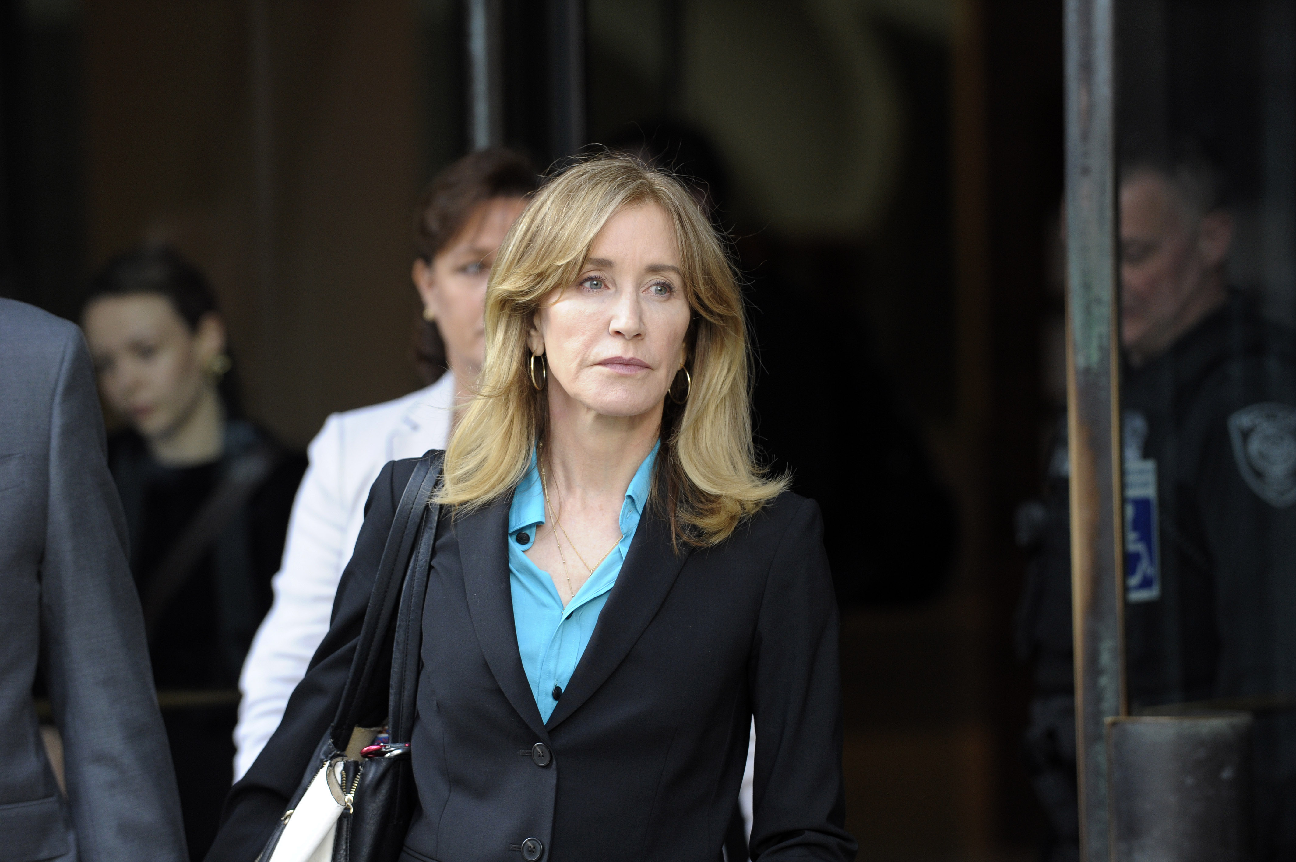 Actress Felicity Huffman exits the courthouse in Boston after facing charges for allegedly conspiring to commit mail fraud and other charges in the college admissions scandal on April 3, 2019. (Credit: Joseph Prezioso / AFP / Getty Images)