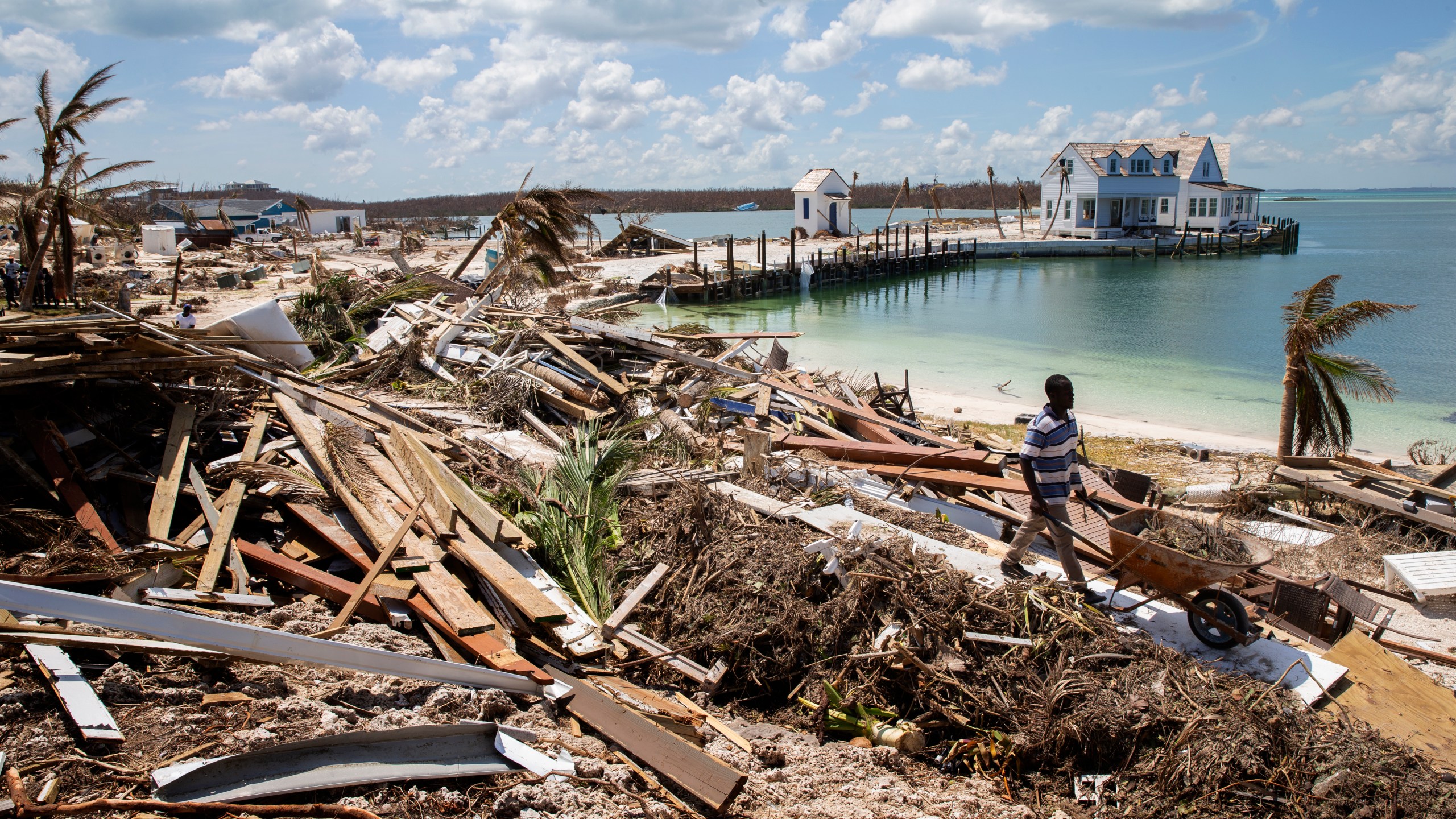 Workers clean debris at the Abaco Inn in Hurricane Dorian-devastated Elbow Key Island on Sept. 7, 2019 the Bahamas. (Credit: Jose Jimenez/Getty Images)