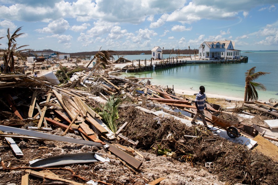 Workers clean debris at the Abaco Inn in Hurricane Dorian-devastated Elbow Key Island on Sept. 7, 2019 the Bahamas. (Credit: Jose Jimenez/Getty Images)