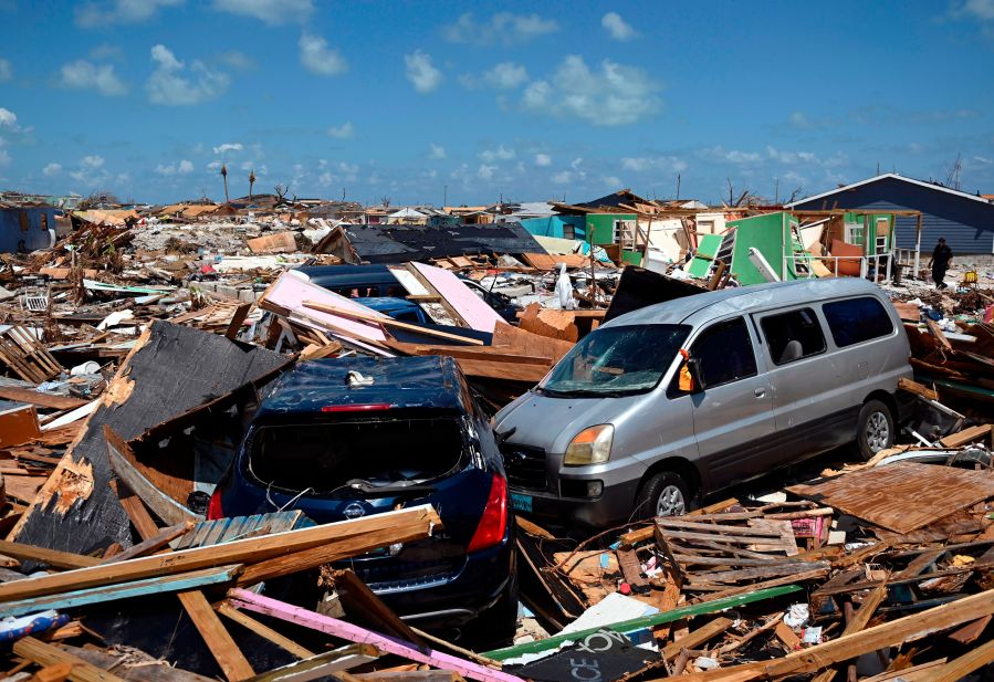 Two cars are seen in an area destroyed by a storm surge in Marsh Harbour, Bahamas on September 10, 2019. (Credit: ANDREW CABALLERO-REYNOLDS/AFP/Getty Images)