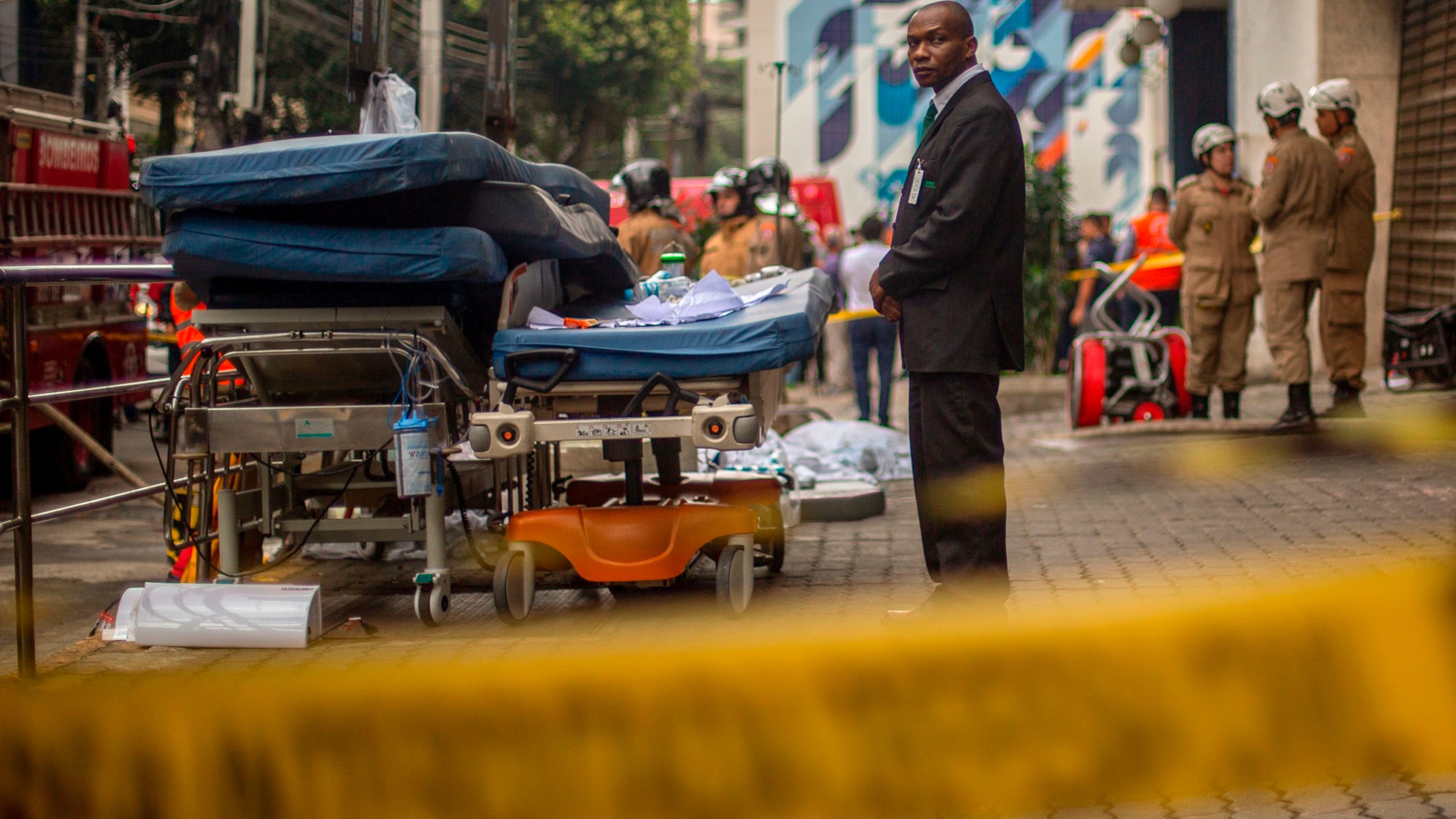 A security officer looks after medical equipment left outside Badim Hospital following a fire at the medical facility in the Tijuca neighborhood, Rio de Janeiro, Brazil, on Sept. 13, 2019. (Credit: MAURO PIMENTEL/AFP/Getty Images)