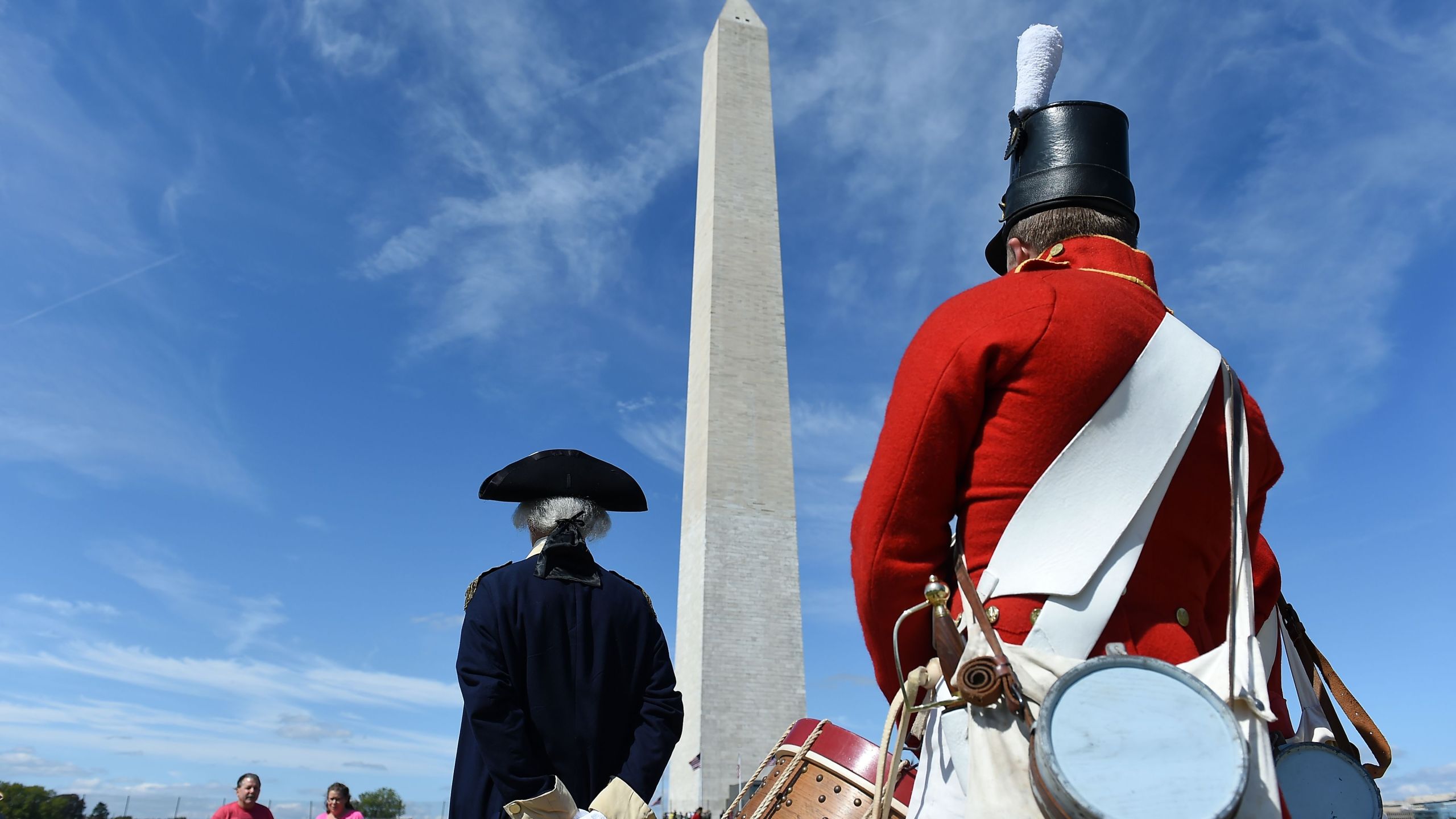 People dressed in historical costumes participate in the reopening of the Washington Monument on Sep. 19, 2019, in Washington, DC. (Credit: Olivier Douliery/AFP/Getty Images)