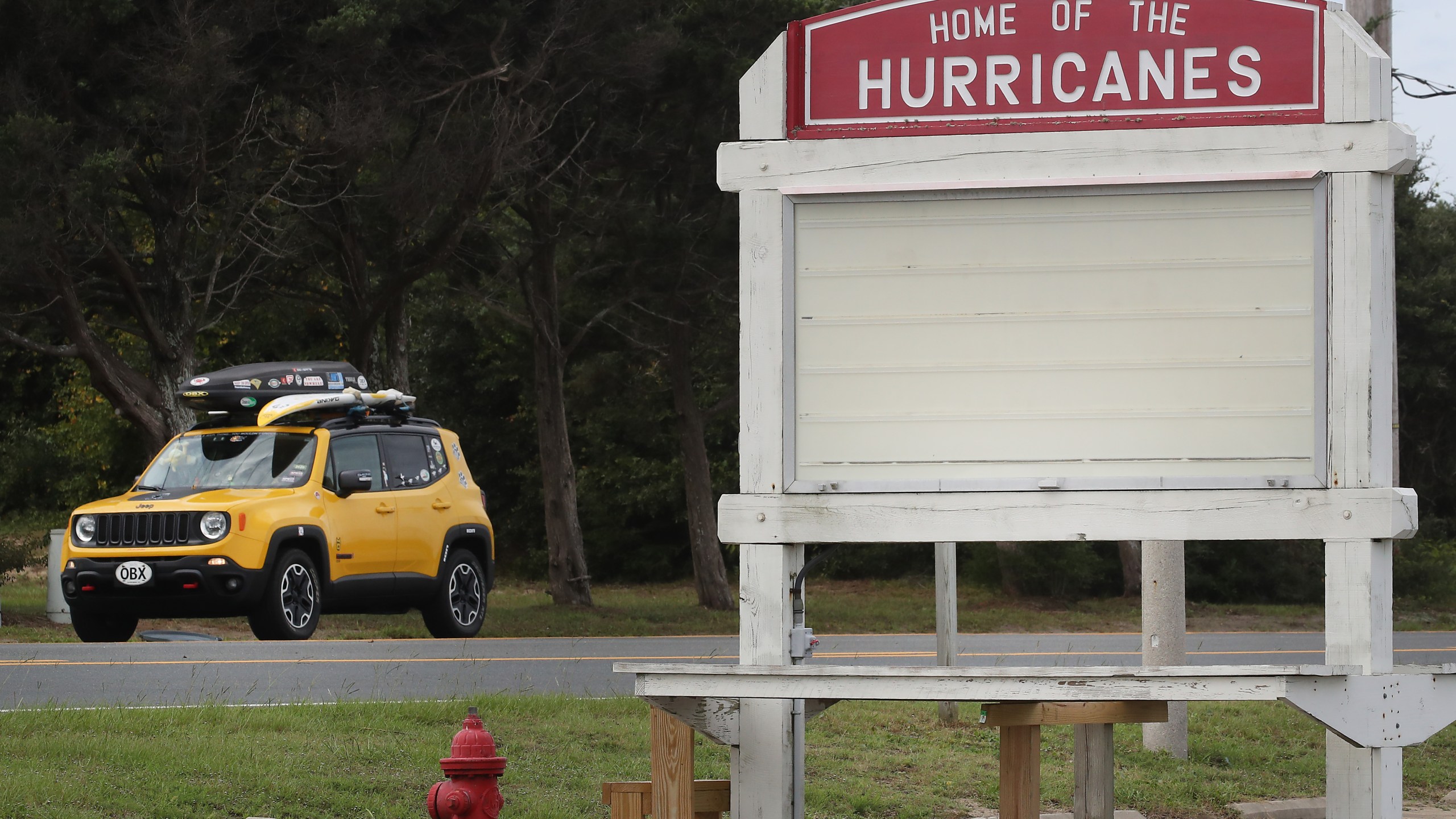 A vehicle drives past the Cape Hatteras Secondary School, an area under a mandatory evacuation due to approaching Hurricane Dorian on September 5, 2019 in Buxton, North Carolina. (Credit: Mark Wilson/Getty Images)