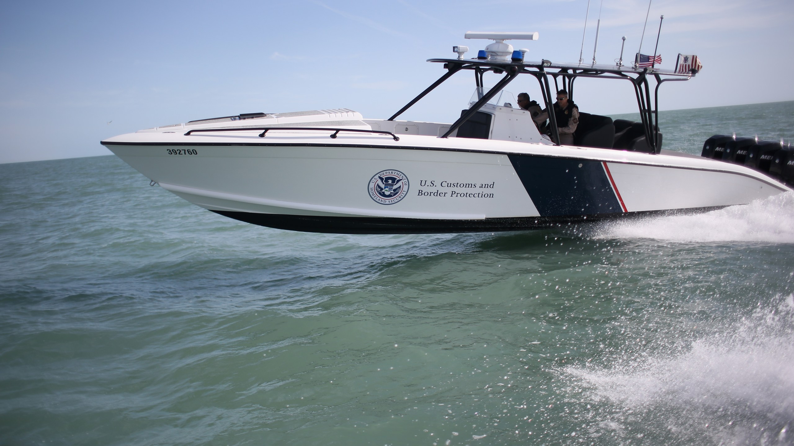 A boat crew from the U.S. Office of Air and Marine (OAM) races through the Gulf of Mexico on April 12, 2013 near Port Isabel, Texas. (Credit: John Moore/Getty Images)