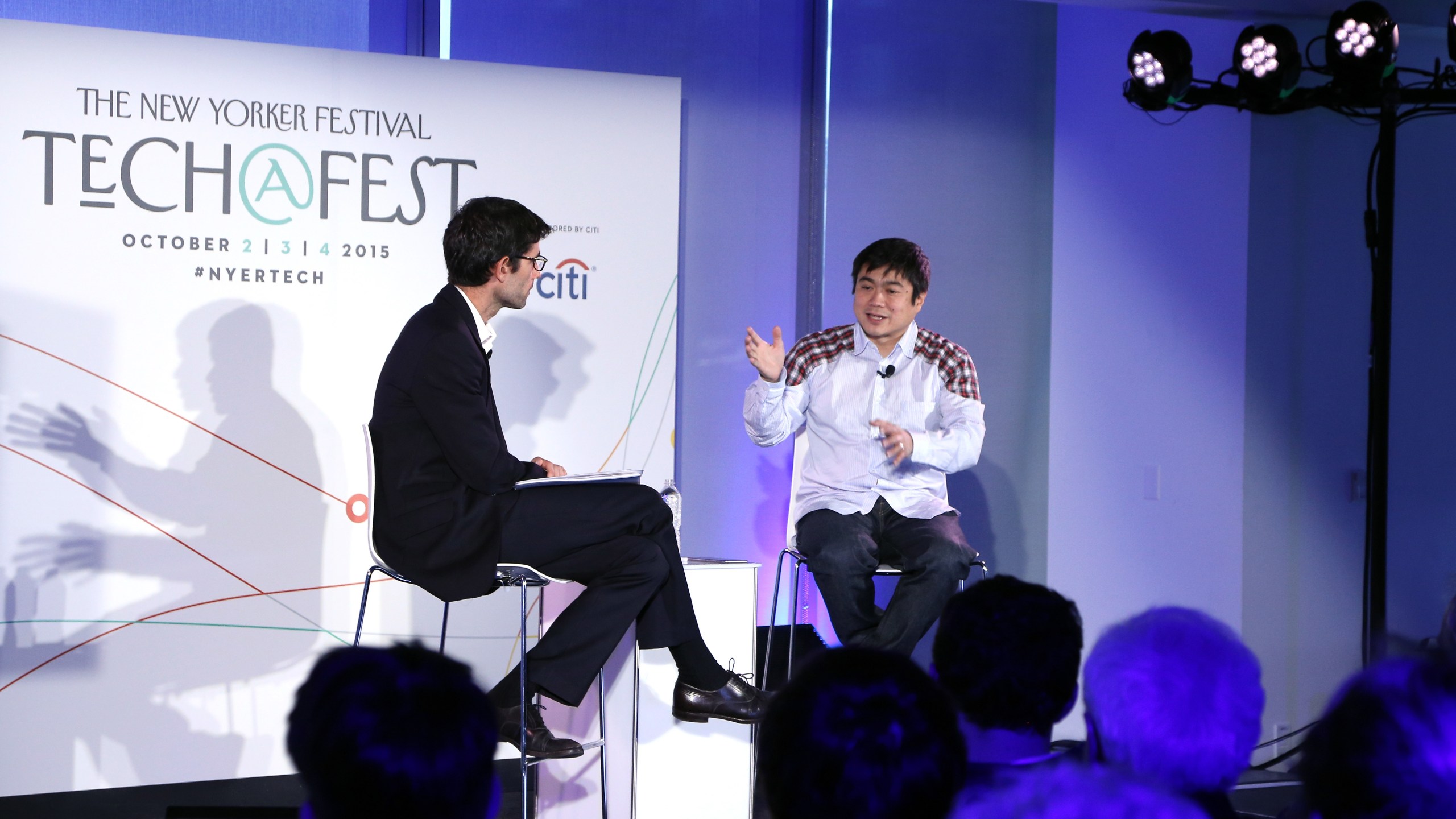 Journalist Nicholas Thompson, left, speaks to then director of the MIT Media Lab Joi Ito on stage during The New Yorker Festival at One World Trade Center on Oct. 3, 2015 in New York City. (Credit: Anna Webber/Getty Images for The New Yorker)