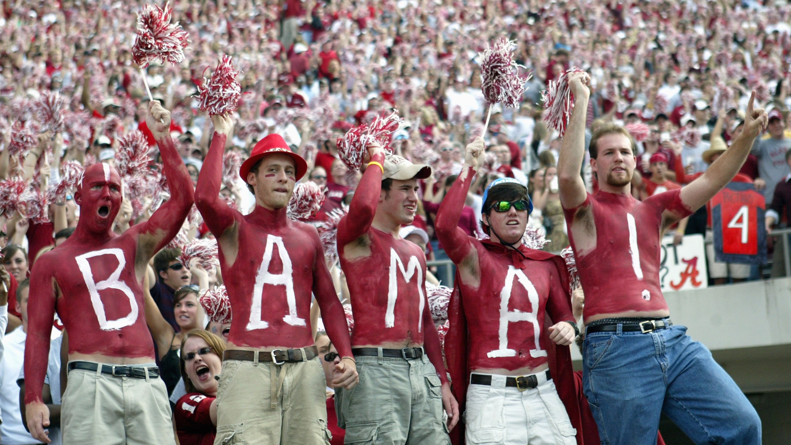 Fans of the University of Alabama Crimson Tide display their body paint during the game with the Louisiana State University Tigers on November 12, 2005 at at Bryant-Denny Stadium in Tuscaloosa, Alabama. (Credit: Chris Graythen/Getty Images)