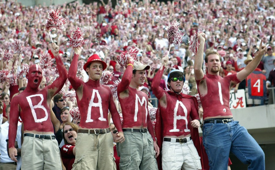 Fans of the University of Alabama Crimson Tide display their body paint during the game with the Louisiana State University Tigers on November 12, 2005 at at Bryant-Denny Stadium in Tuscaloosa, Alabama. (Credit: Chris Graythen/Getty Images)