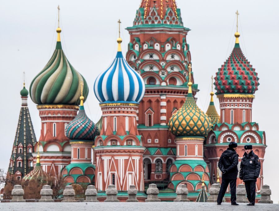 Two policemen stand guard on the Red Square in front of St. Basil Cathedral on National Unity Day in Moscow on November 4, 2017. (Credit: MLADEN ANTONOV/AFP/Getty Images)