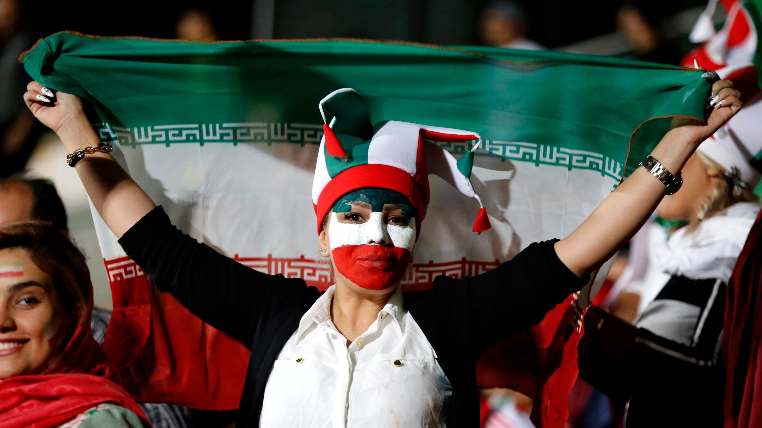 An Iranian woman watches the World Cup soccer match between Portugal and Iran at Azadi stadium in Tehran on June 25, 2018.(Credit: Atta Kenare/AFP/Getty Images)