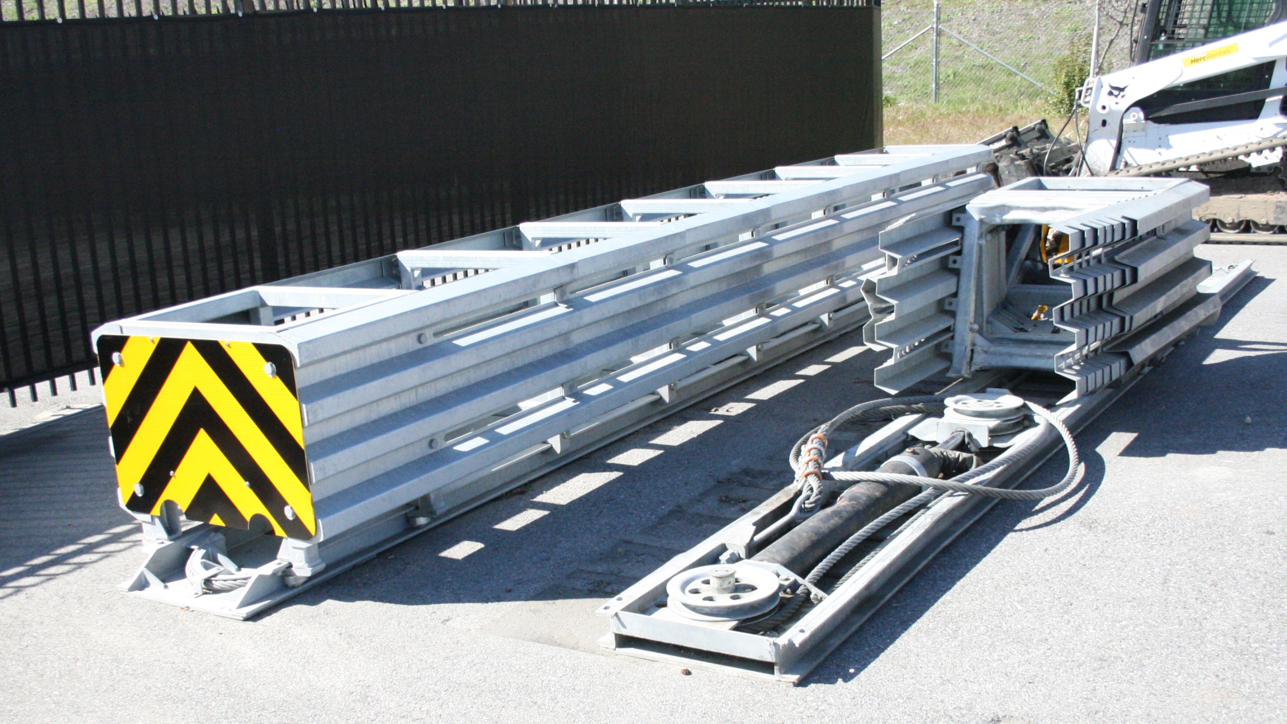 Taken on March 28, 2018, this photo at a California Department of Transportation yard shows (on right) the crash attenuator involved in a fatal crash in Mountain View on March 23, 2018. On the left is an undamaged attenuator. (Credit: California Department of Transportation via NTSB)