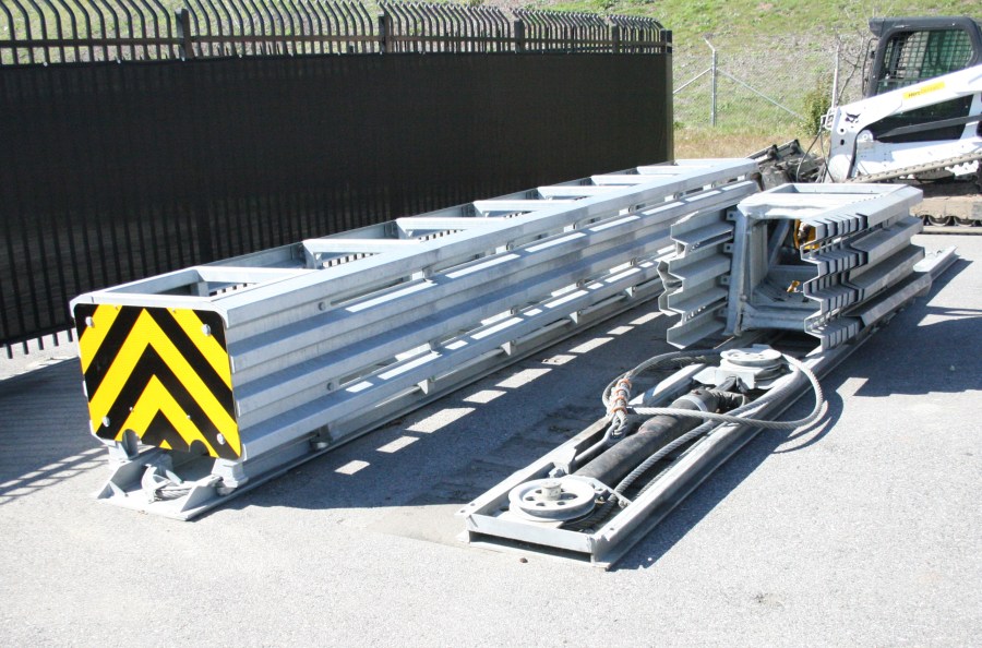 Taken on March 28, 2018, this photo at a California Department of Transportation yard shows (on right) the crash attenuator involved in a fatal crash in Mountain View on March 23, 2018. On the left is an undamaged attenuator. (Credit: California Department of Transportation via NTSB)