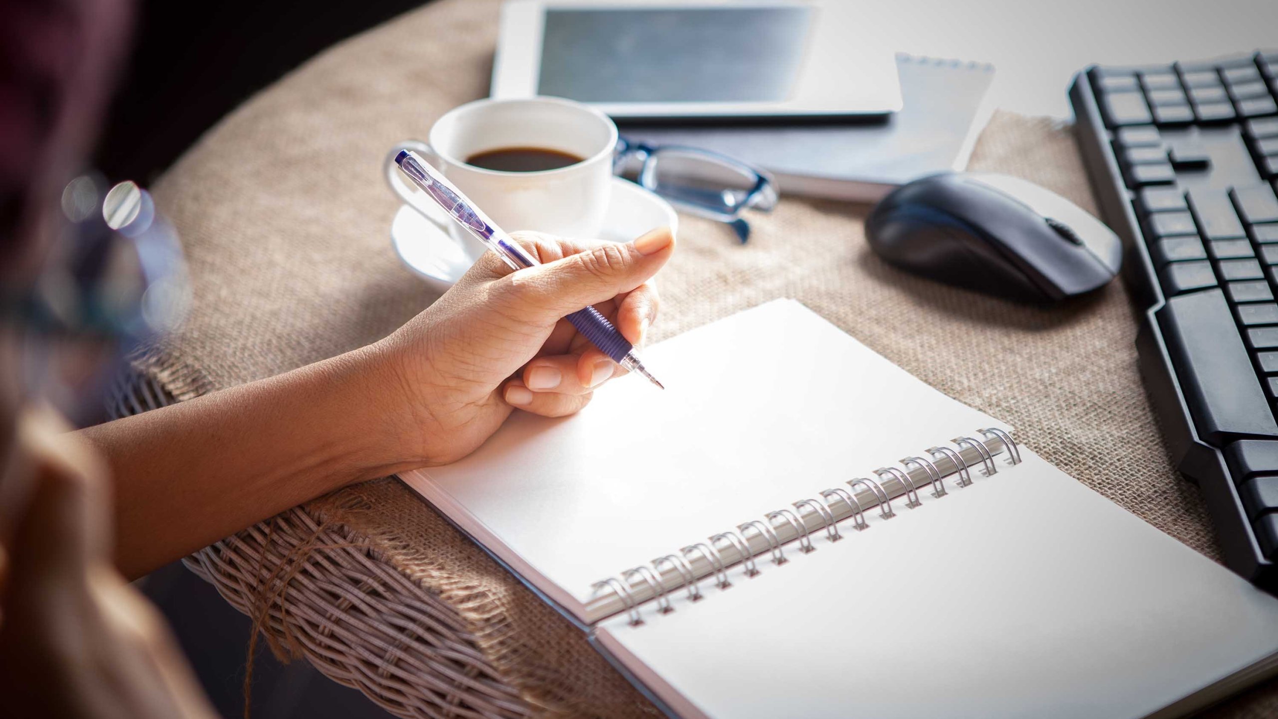 A left-handed person holds a pen in this file photo. (Credit: Shuttersotck via CNN)