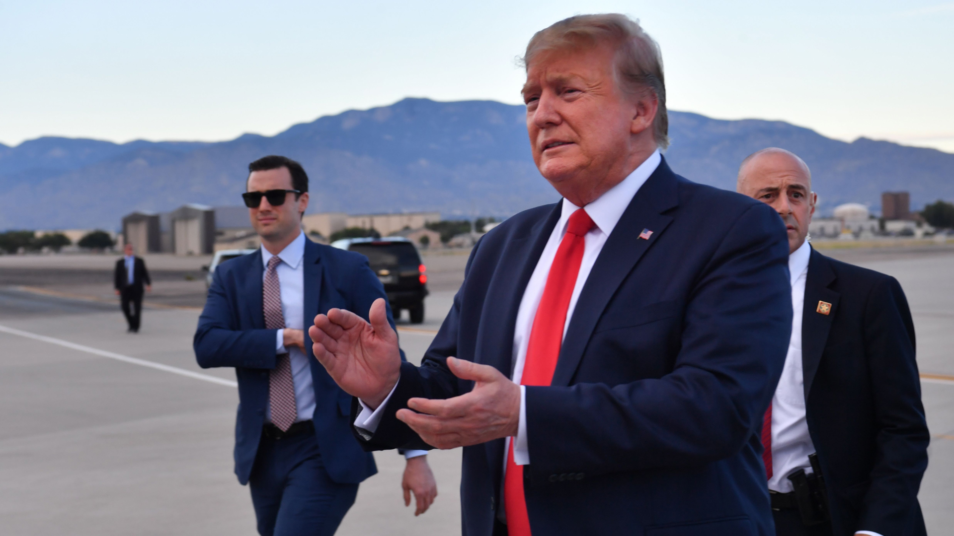 US President Donald Trump walks to greet well-wishers after arriving at Albuquerque International Sunport in Albuquerque, New Mexico, on September 16, 2019 ahead of a campaign rally in Rio Rancho. (Credit: NICHOLAS KAMM/AFP/Getty Images)