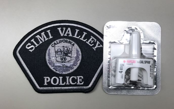 A Naxalone dosage is seen next to a Simi Valley Police Department patch in this undated photo provided by police.