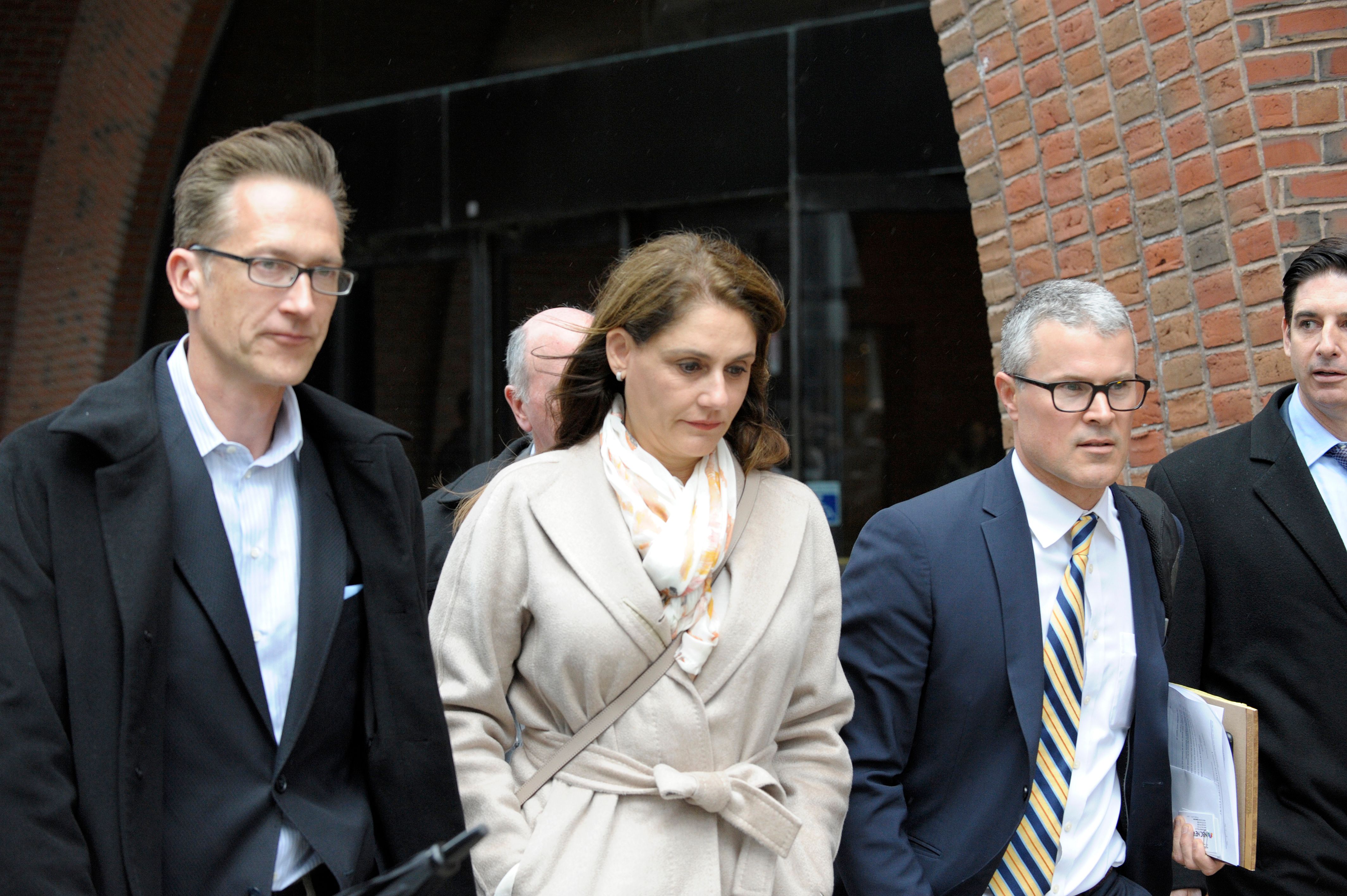 Michelle Janavs makes her way out of the courthouse after giving her plea in front of a judge for charges in the college admissions scandal at the John Joseph Moakley U.S. Courthouse on March 29, 2019. (Credit: JOSEPH PREZIOSO/AFP/Getty Images)