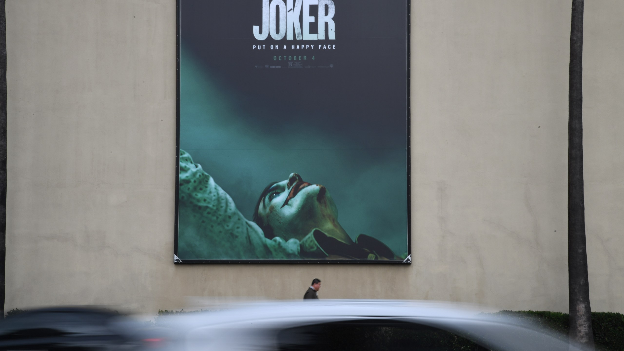 A poster for the upcoming film "The Joker" is seen outside Warner Brothers Studios in Burbank, Calif., Sept. 27, 2019. (Credit: ROBYN BECK/AFP/Getty Images)