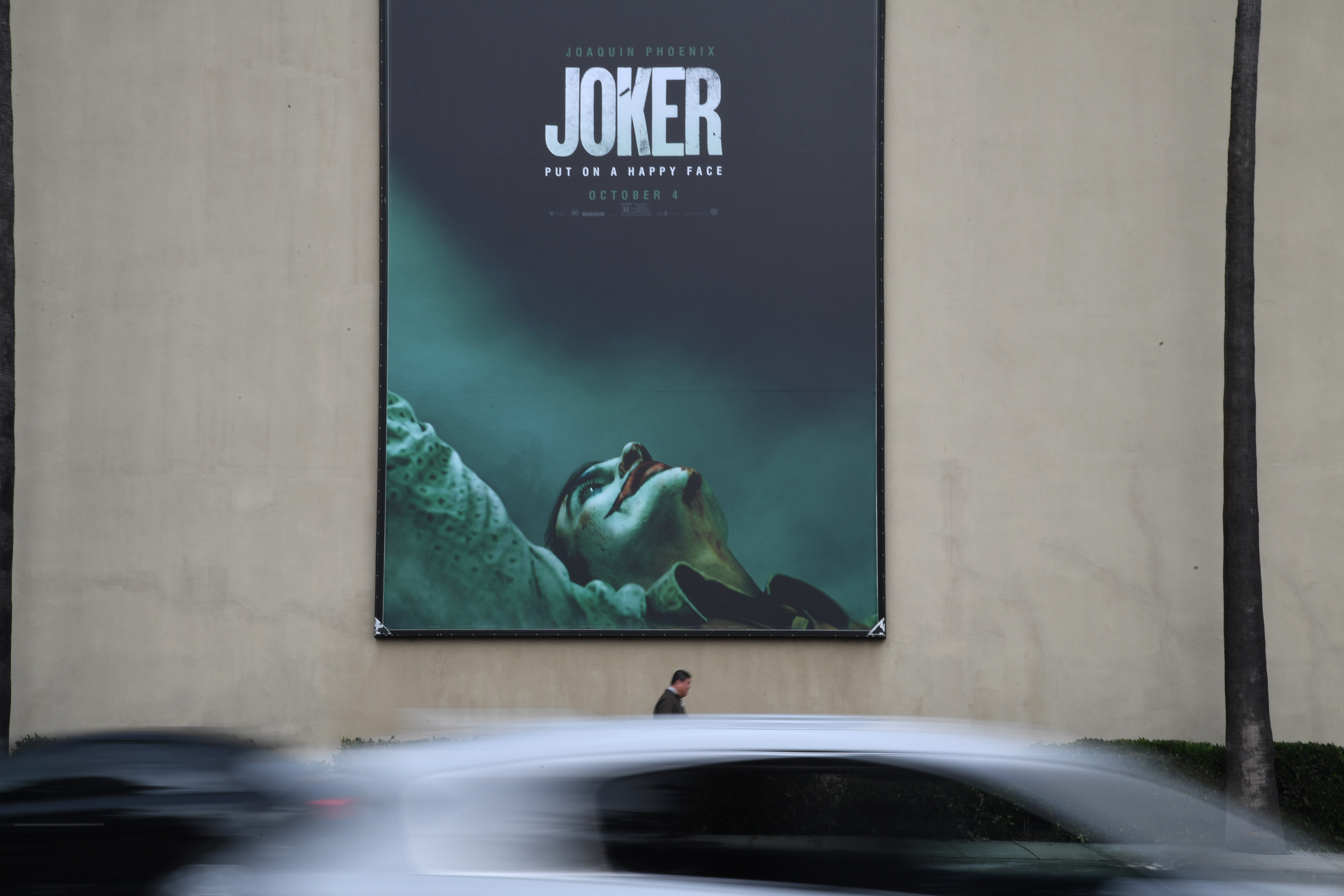 A poster for the upcoming film "The Joker" is seen outside Warner Brothers Studios in Burbank, Calif., Sept. 27, 2019. (Credit: ROBYN BECK/AFP/Getty Images)