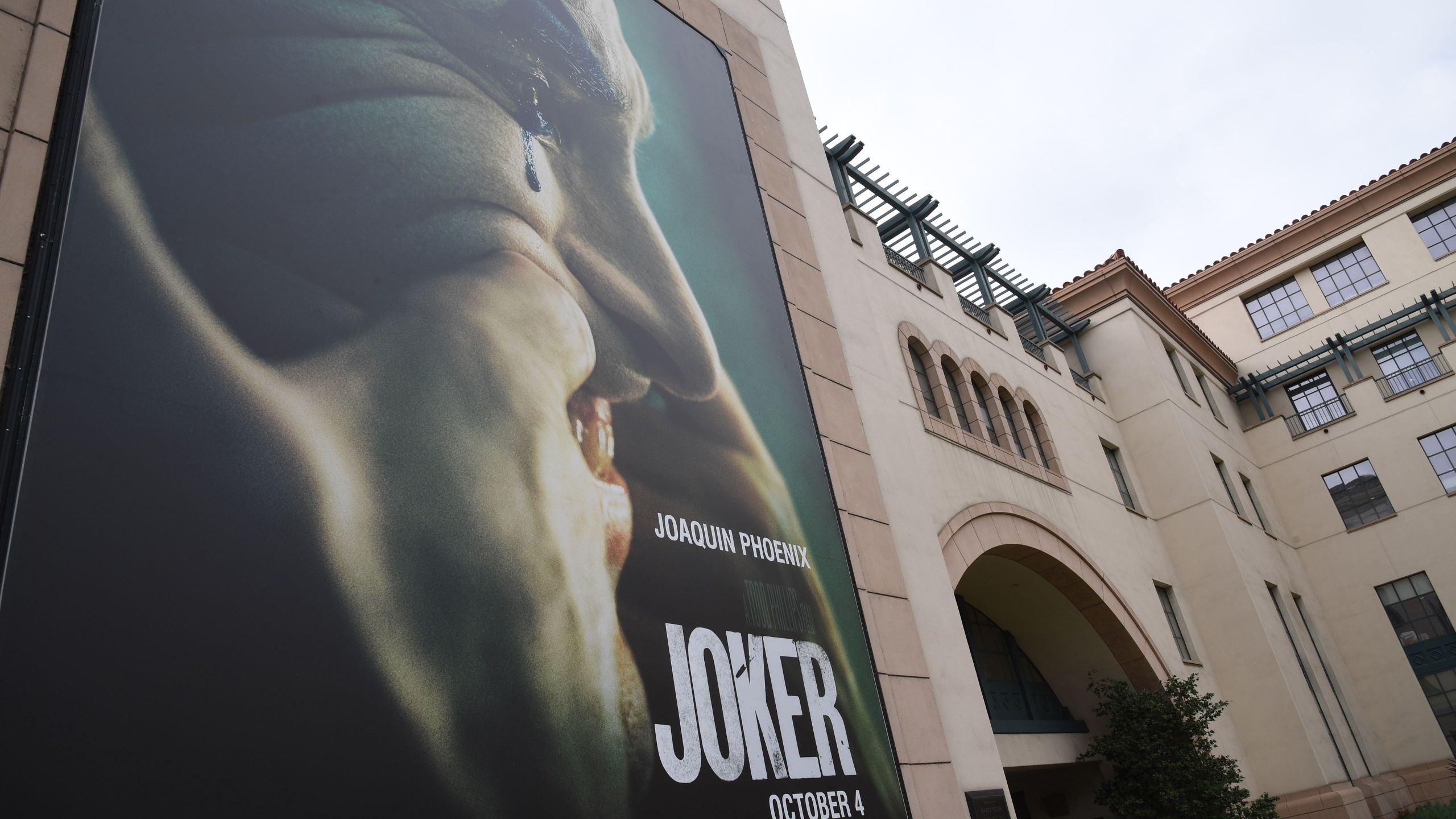 A poster for the upcoming film "The Joker" is seen outside Warner Brothers Studios in Burbank, California, Sept. 27, 2019. (Credit: ROBYN BECK/AFP/Getty Images)