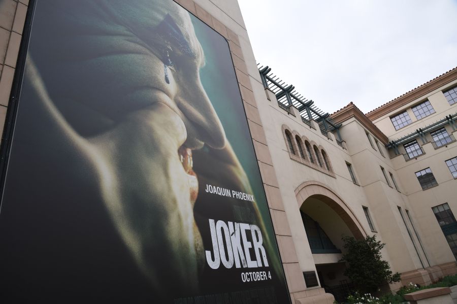 A poster for the upcoming film "The Joker" is seen outside Warner Brothers Studios in Burbank, California, Sept. 27, 2019. (Credit: ROBYN BECK/AFP/Getty Images)