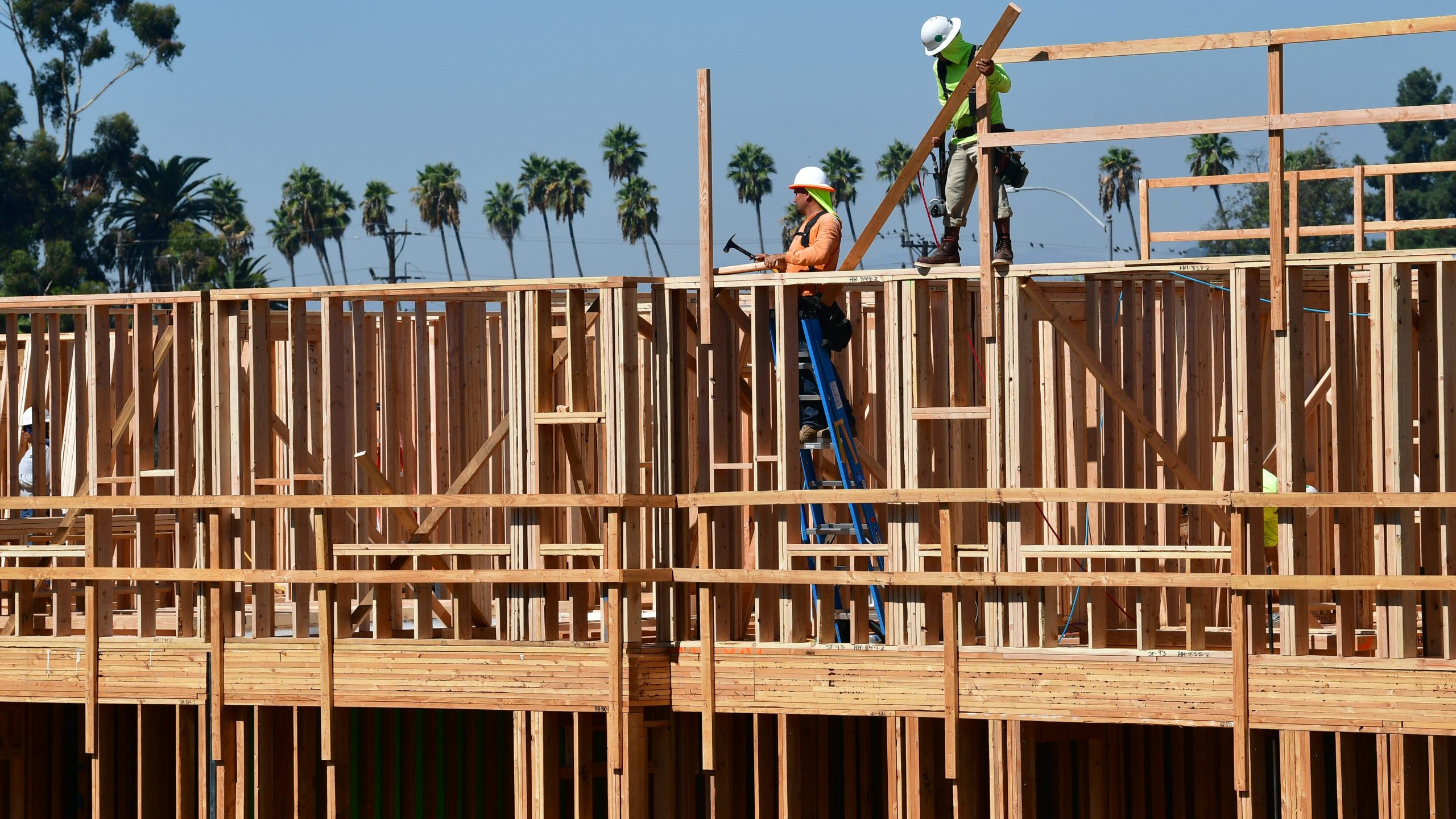 Construction workers are seen on the site of a new building in Los Angeles, California on Oct. 8, 2019. (Credit: Frederic J. Brown /AFP via Getty Images)