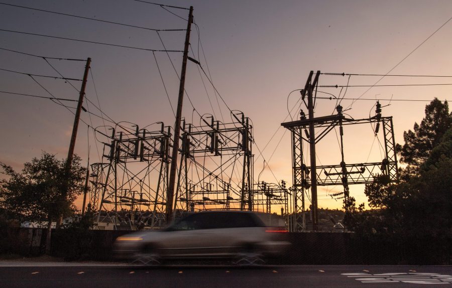 A motorist drives pass a power station in Mill Valley during a Pacific Gas & Electric blackout on Oct. 10, 2019. (Josh Edelson / AFP / Getty Images)