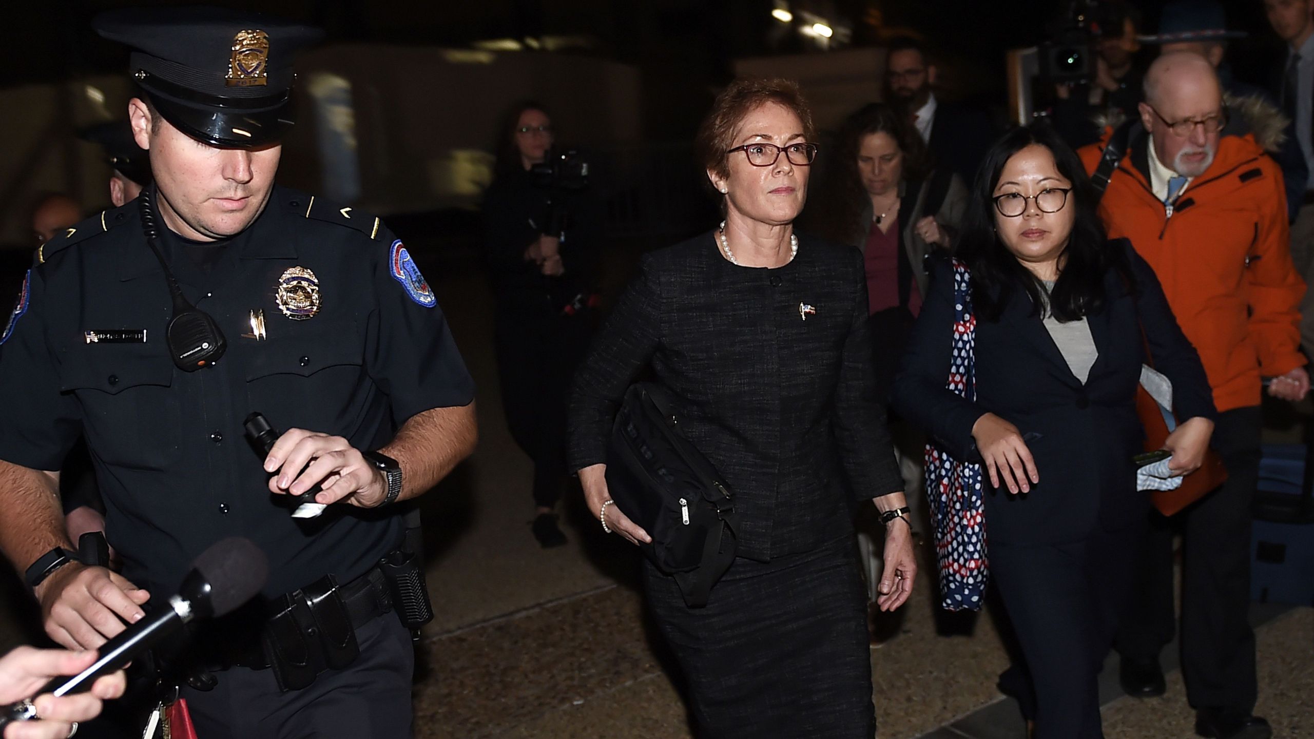 Former U.S. Ambassador to Ukraine Marie Yovanovitch (C) flanked by lawyers, aides and Capitol police, leaves the US Capitol Oct. 11, 2019, in Washington, D.C., after testifying behind closed doors to the House Intelligence, Foreign Affairs and Oversight committees as part of the ongoing impeachment investigation against President Donald Trump. (Credit: OLIVIER DOULIERY/AFP via Getty Images)